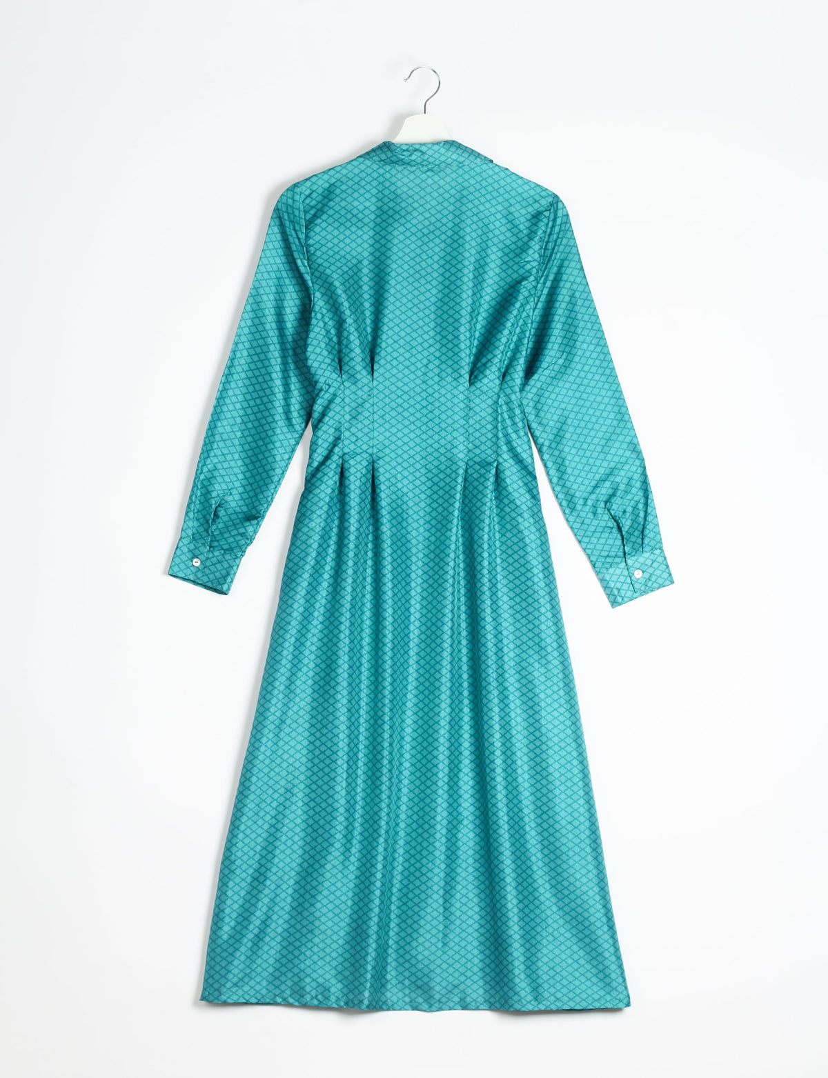 Blue midi shirt dress with micro diamond pattern, long sleeves, buttoned cuffs, shown from back on hanger