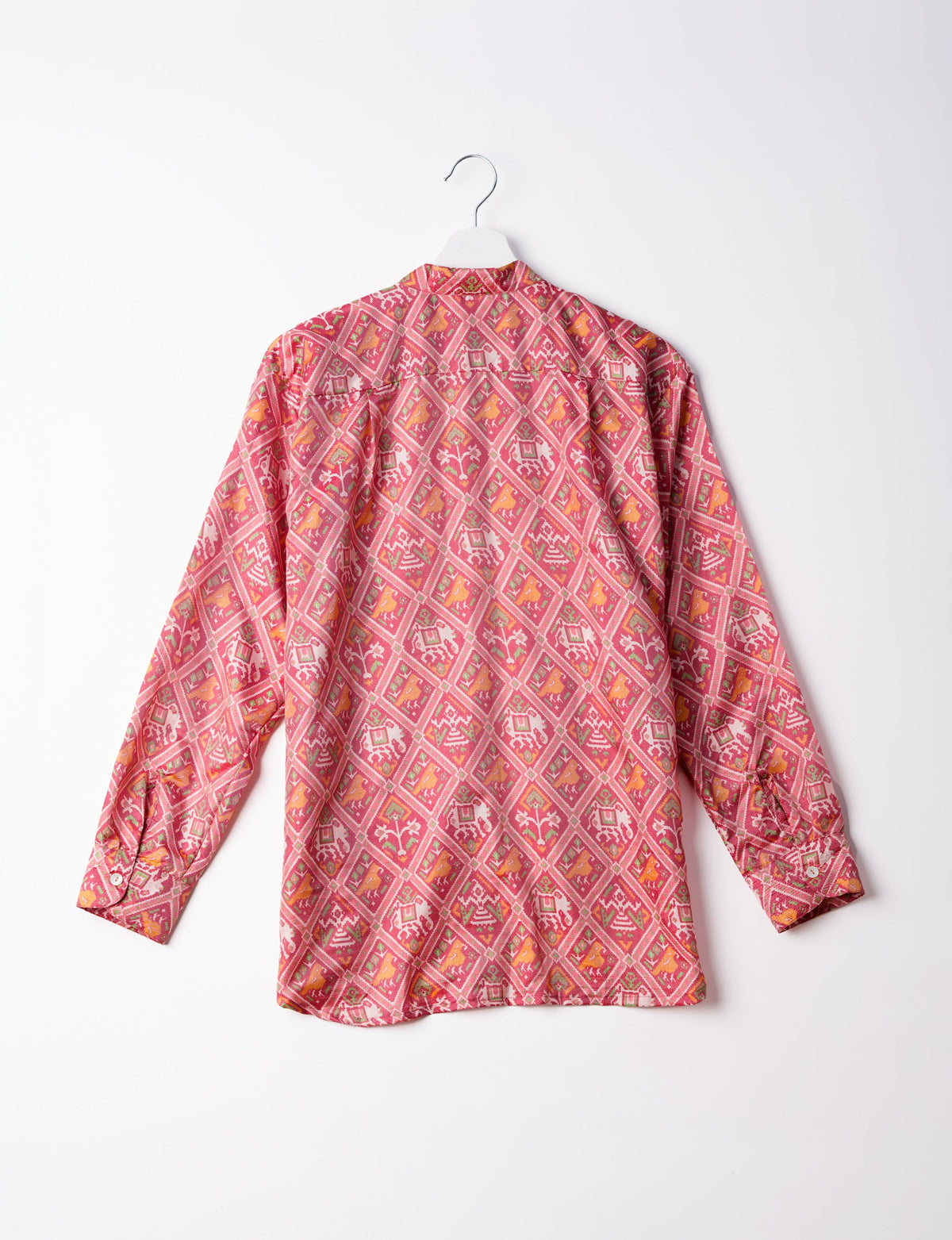 Sophisticated LONGLINE SHIRT with mandarin collar, bias yoke, and delicate bead embroidery edging. Crafted for sustainable fashion enthusiasts, this eco-friendly shirt offers versatile styling and timeless elegance for your conscious wardrobe.