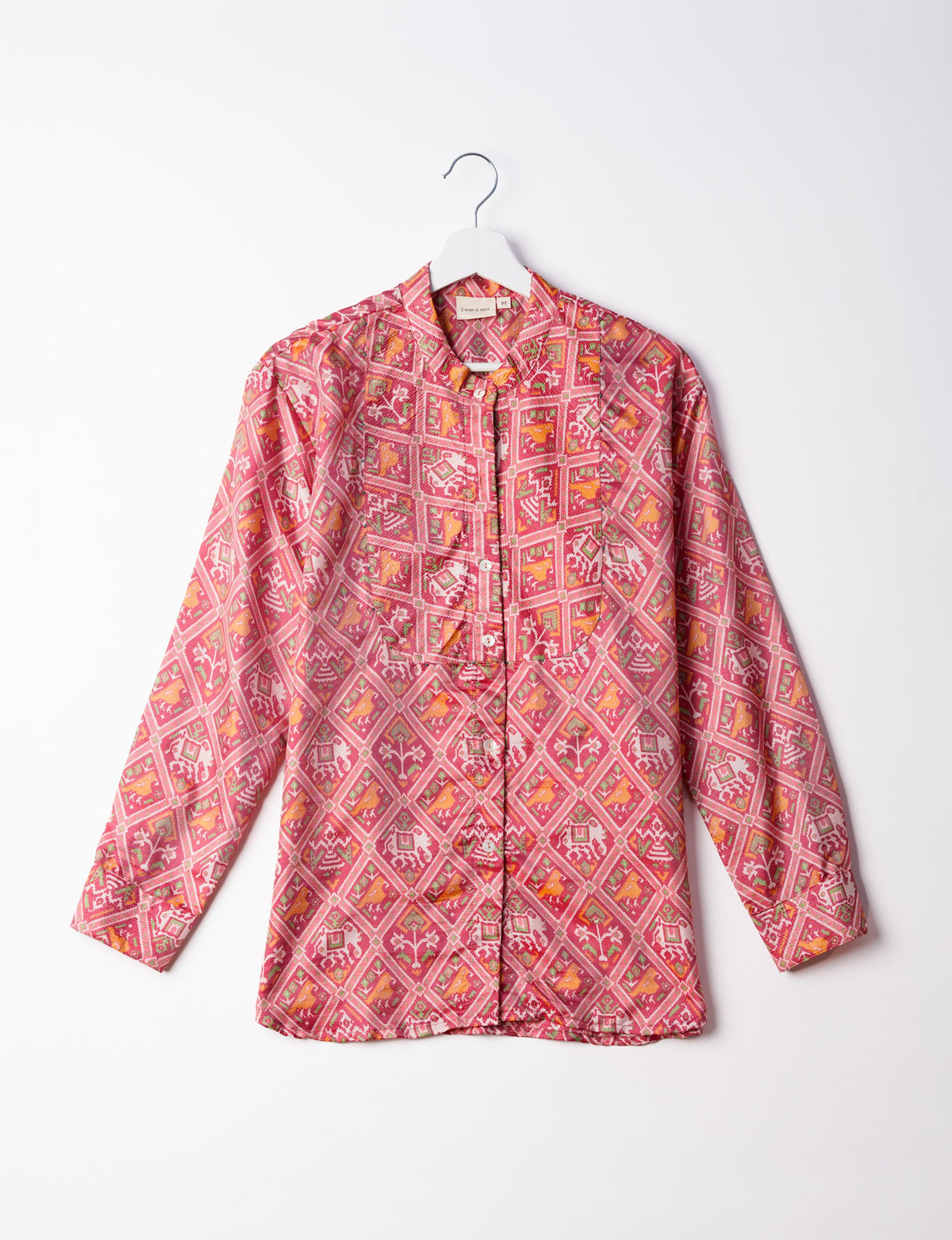 Sophisticated LONGLINE SHIRT with mandarin collar, bias yoke, and delicate bead embroidery edging. Crafted for sustainable fashion enthusiasts, this eco-friendly shirt offers versatile styling and timeless elegance for your conscious wardrobe.