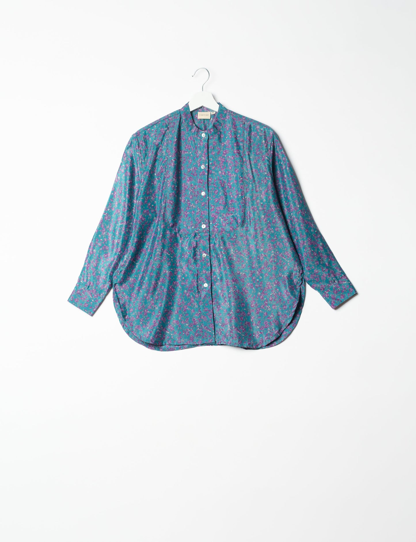 Sophisticated LONGLINE SHIRT with mandarin collar, bias yoke, and delicate bead embroidery edging. Crafted for sustainable fashion enthusiasts, this eco-friendly shirt offers versatile styling and timeless elegance for your conscious wardrobe.