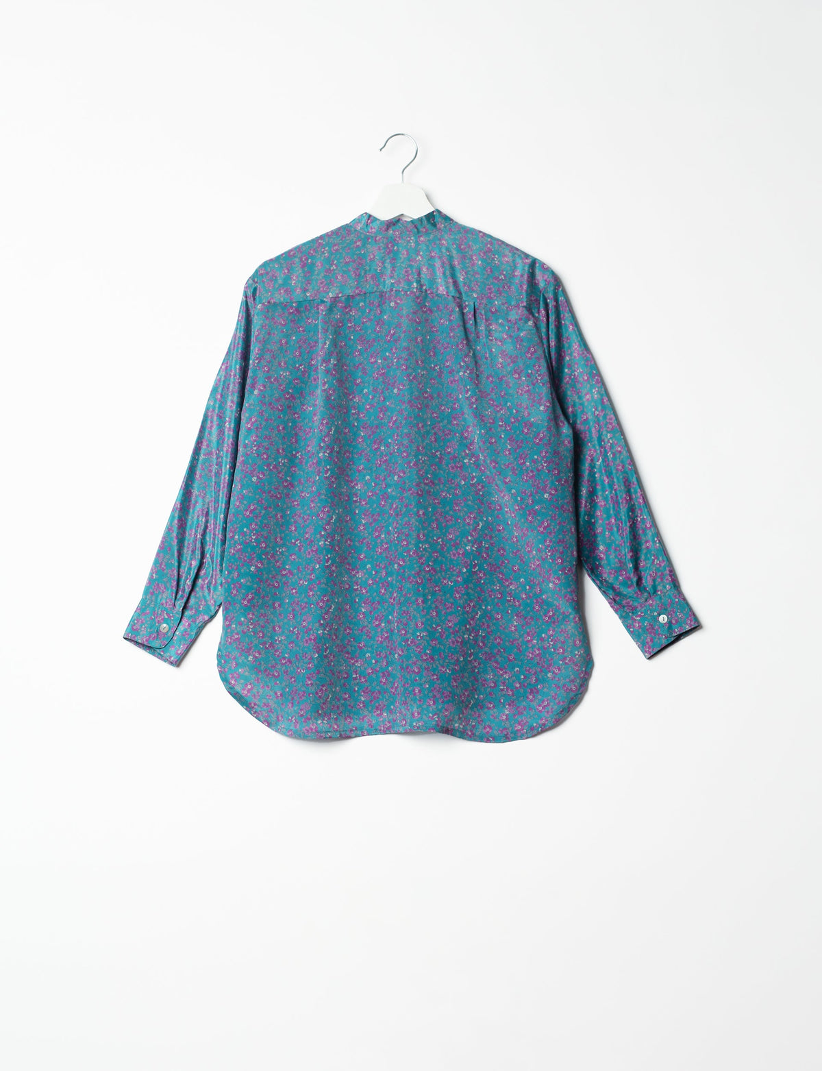 Sophisticated LONGLINE SHIRT with mandarin collar, bias yoke, and delicate bead embroidery edging. Crafted for sustainable fashion enthusiasts, this eco-friendly shirt offers versatile styling and timeless elegance for your conscious wardrobe.