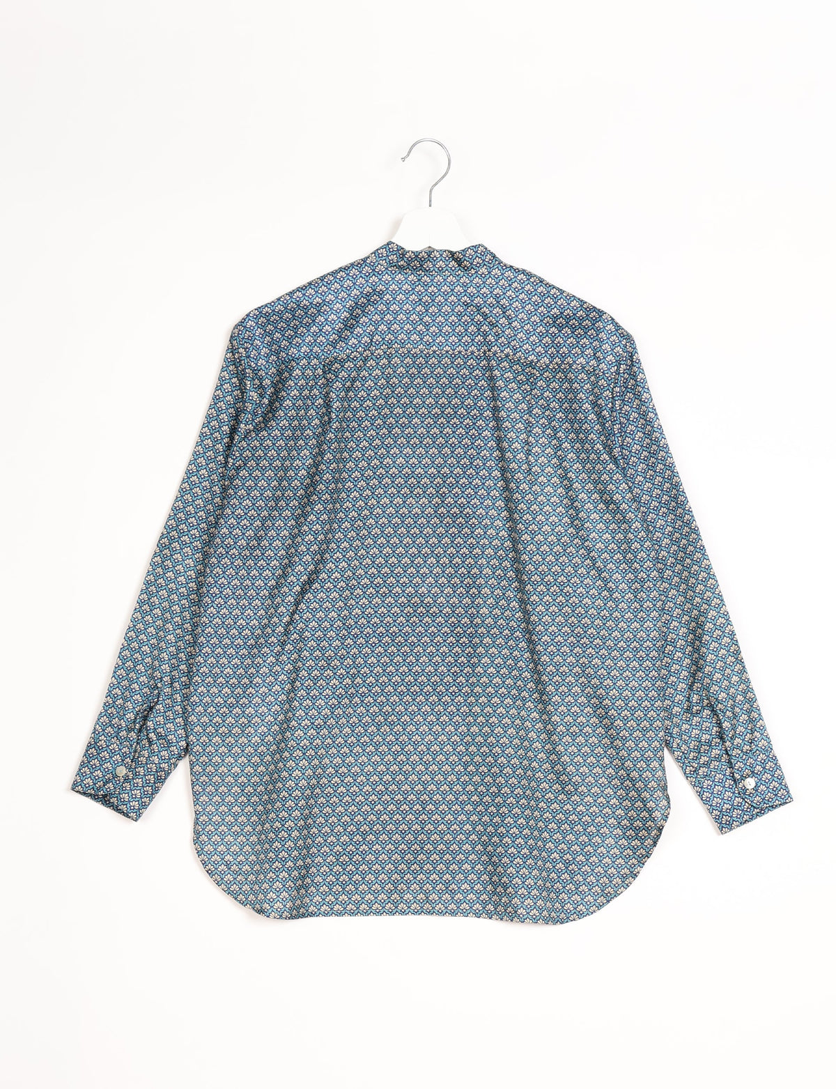 Sophisticated LONGLINE SHIRT with mandarin collar, bias yoke, and delicate bead embroidery edging. Crafted for sustainable fashion enthusiasts, this eco-friendly shirt offers versatile styling and timeless elegance for your conscious wardrobe.