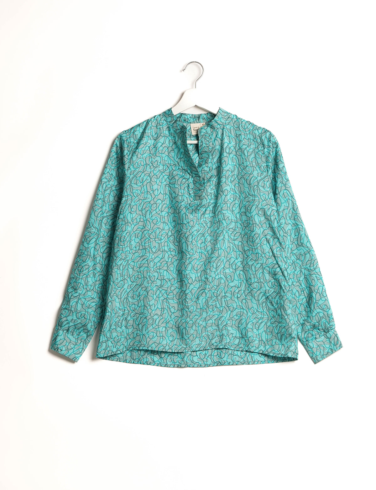 Versatile DAY BLOUSE, a sustainable wardrobe essential with a classic Johnny collar and full sleeves. Lightweight fabric for a comfortable fit, perfect for dressing up or down. Explore ethical clothing and green fashion with this eco-friendly and timeless piece, perfect for any occasion.
