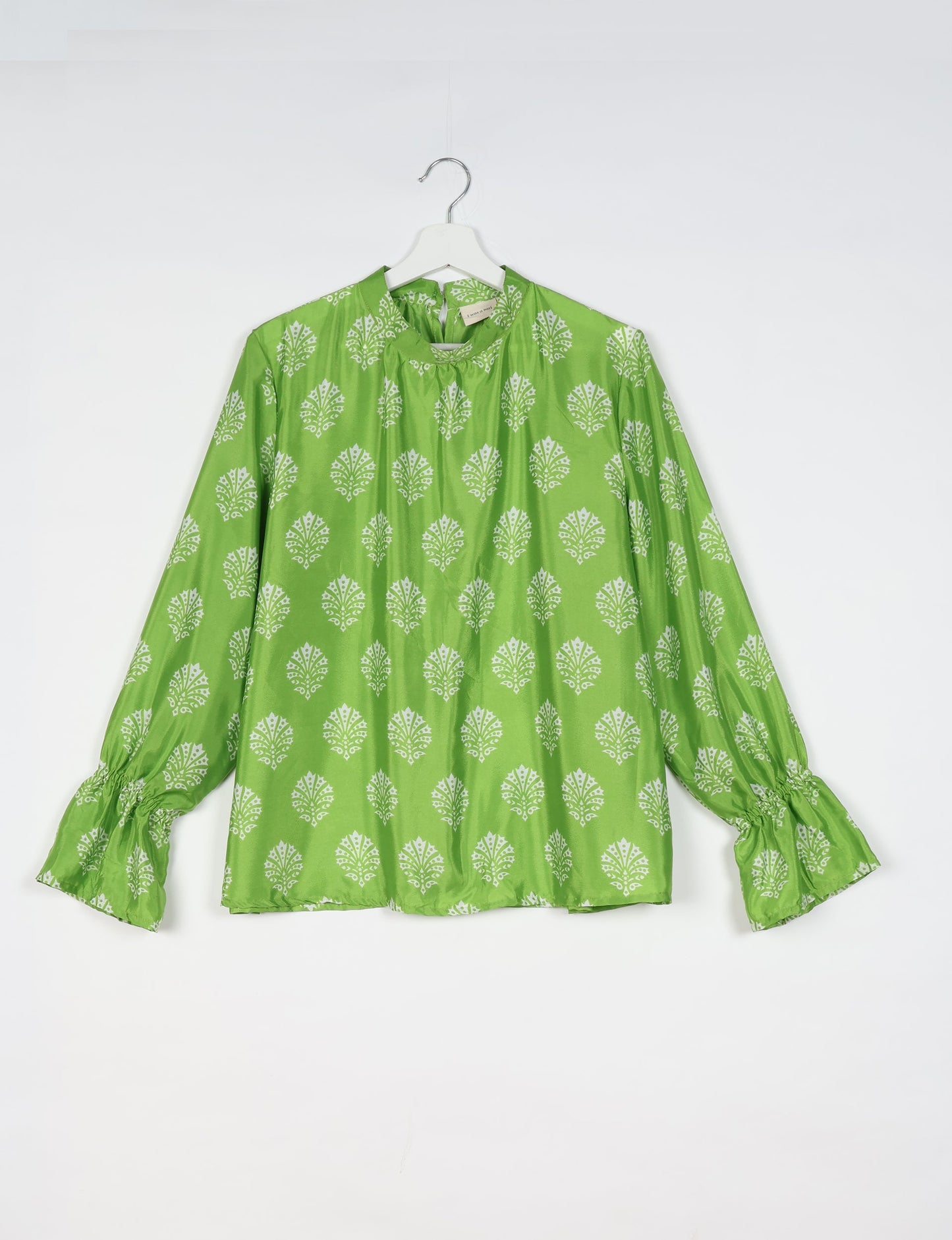 Flowing blouse with peasant sleeves and gathered neckline made from upcycled garments and repurposed clothing, showcasing eco clothing and fair trade fashion in a stylish, comfortable design.