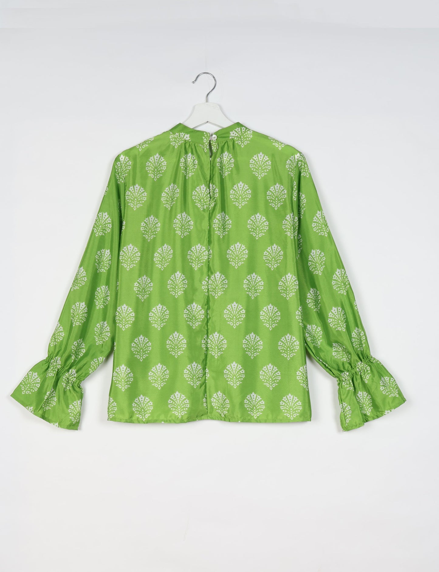Flowing blouse with peasant sleeves and gathered neckline made from upcycled garments and repurposed clothing, showcasing eco clothing and fair trade fashion in a stylish, comfortable design.