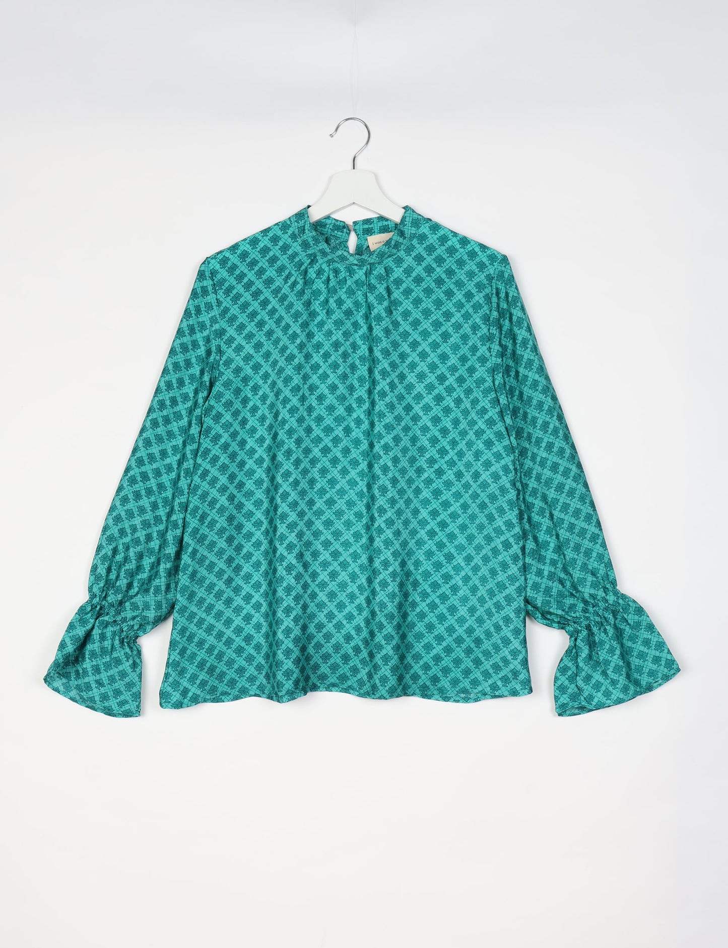 Flowing blouse with peasant sleeves and gathered neckline made from upcycled garments and repurposed clothing, showcasing eco clothing and fair trade fashion in a stylish, comfortable design.
