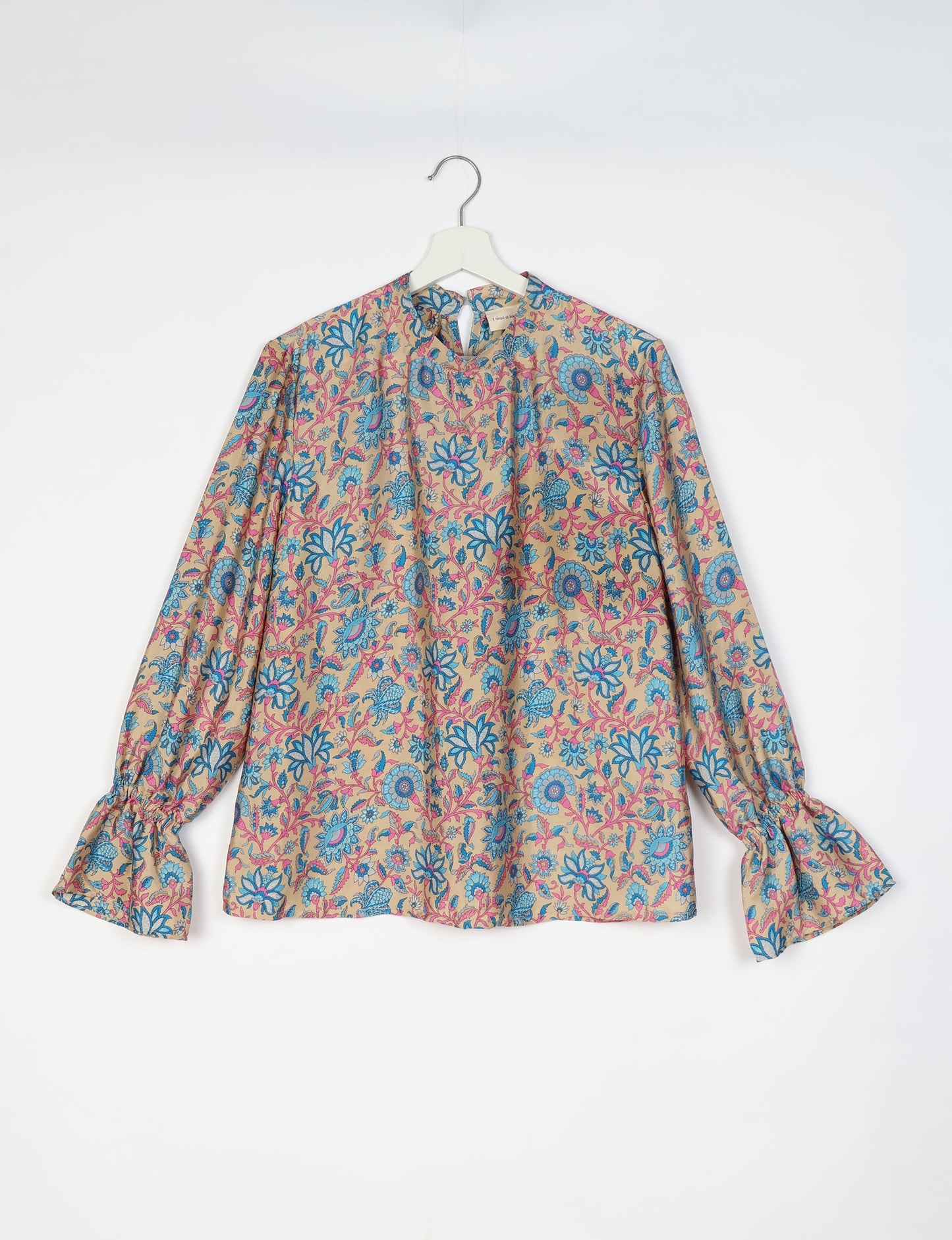 Flowing blouse with peasant sleeves and gathered neckline made from upcycled garments and repurposed clothing, showcasing eco clothing and fair trade fashion in a stylish, comfortable design.