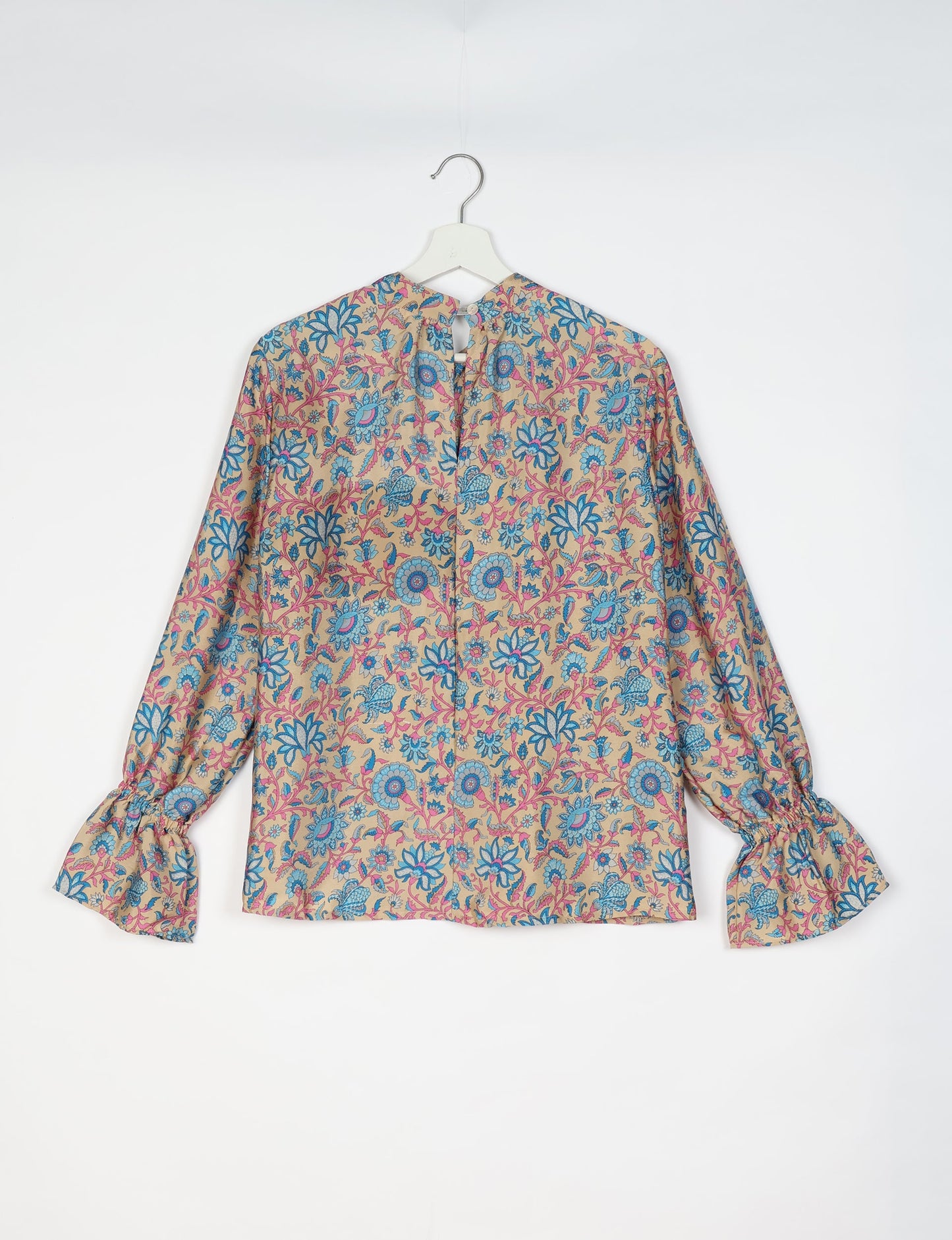 Flowing blouse with peasant sleeves and gathered neckline made from upcycled garments and repurposed clothing, showcasing eco clothing and fair trade fashion in a stylish, comfortable design.