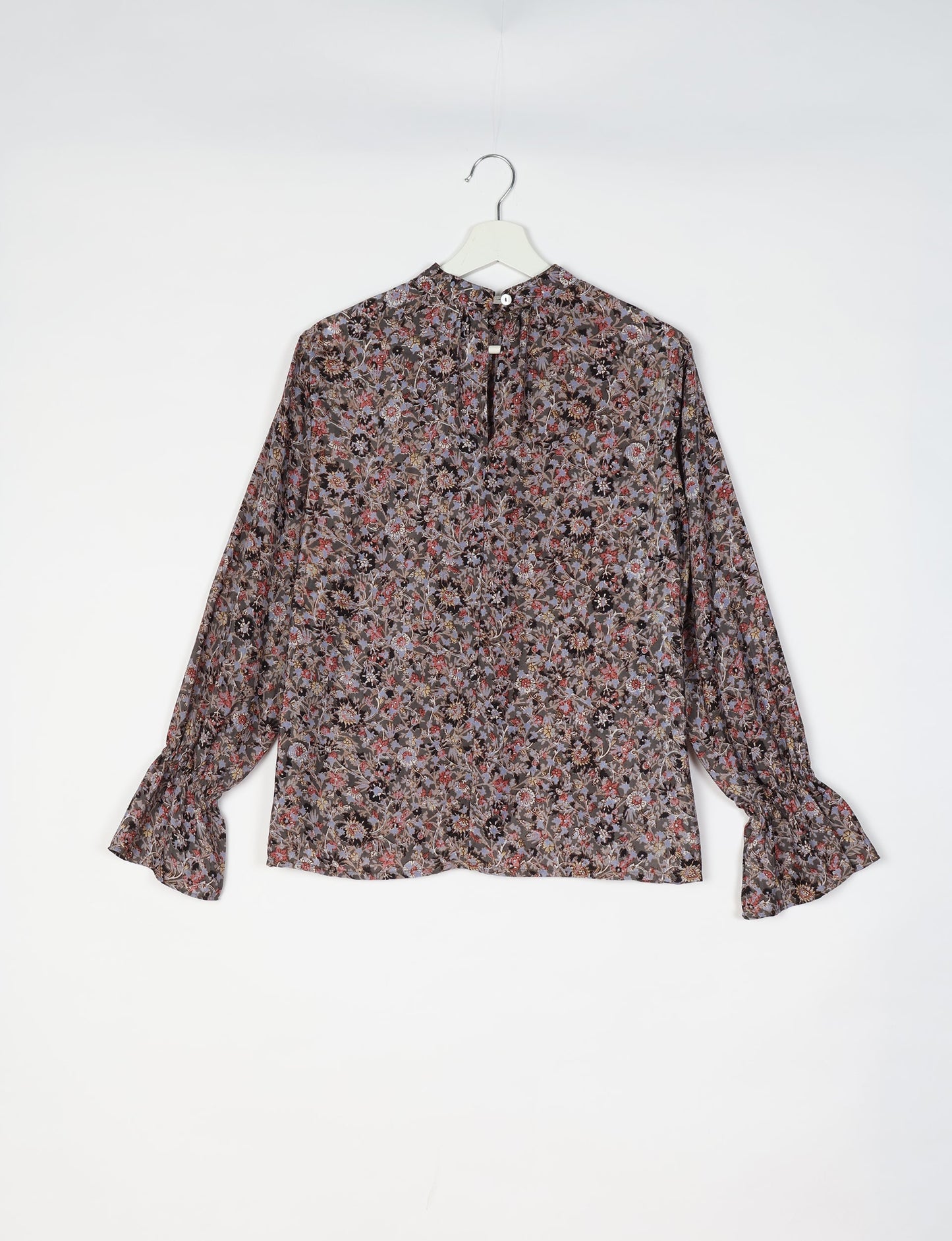 Flowing blouse with peasant sleeves and gathered neckline made from upcycled garments and repurposed clothing, showcasing eco clothing and fair trade fashion in a stylish, comfortable design.