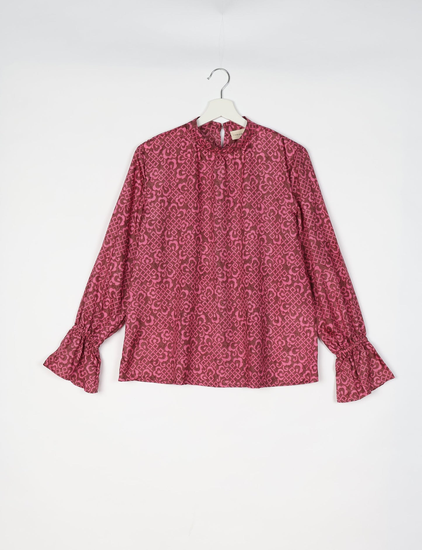 Flowing blouse with peasant sleeves and gathered neckline made from upcycled garments and repurposed clothing, showcasing eco clothing and fair trade fashion in a stylish, comfortable design.