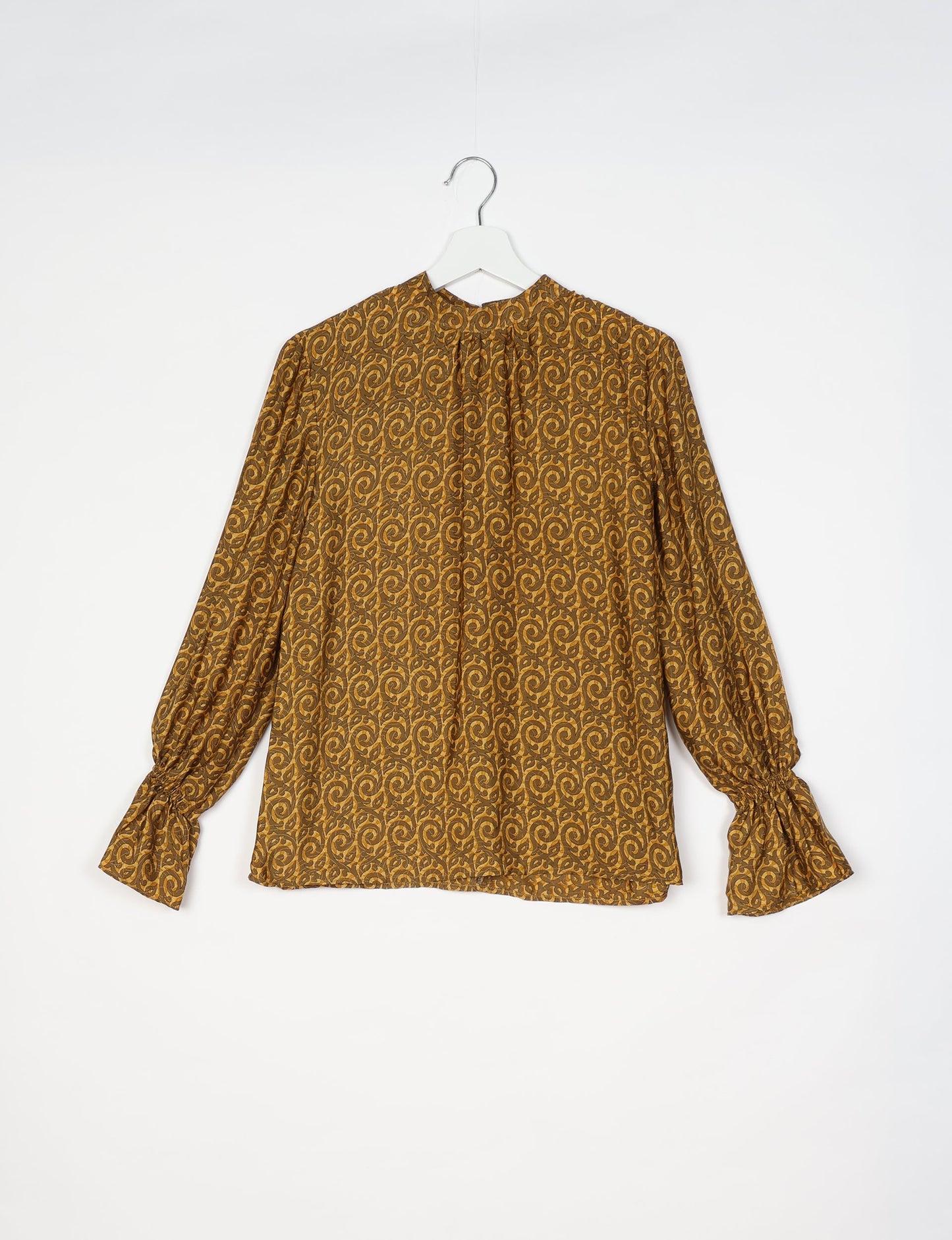 Flowing blouse with peasant sleeves and gathered neckline made from upcycled garments and repurposed clothing, showcasing eco clothing and fair trade fashion in a stylish, comfortable design.