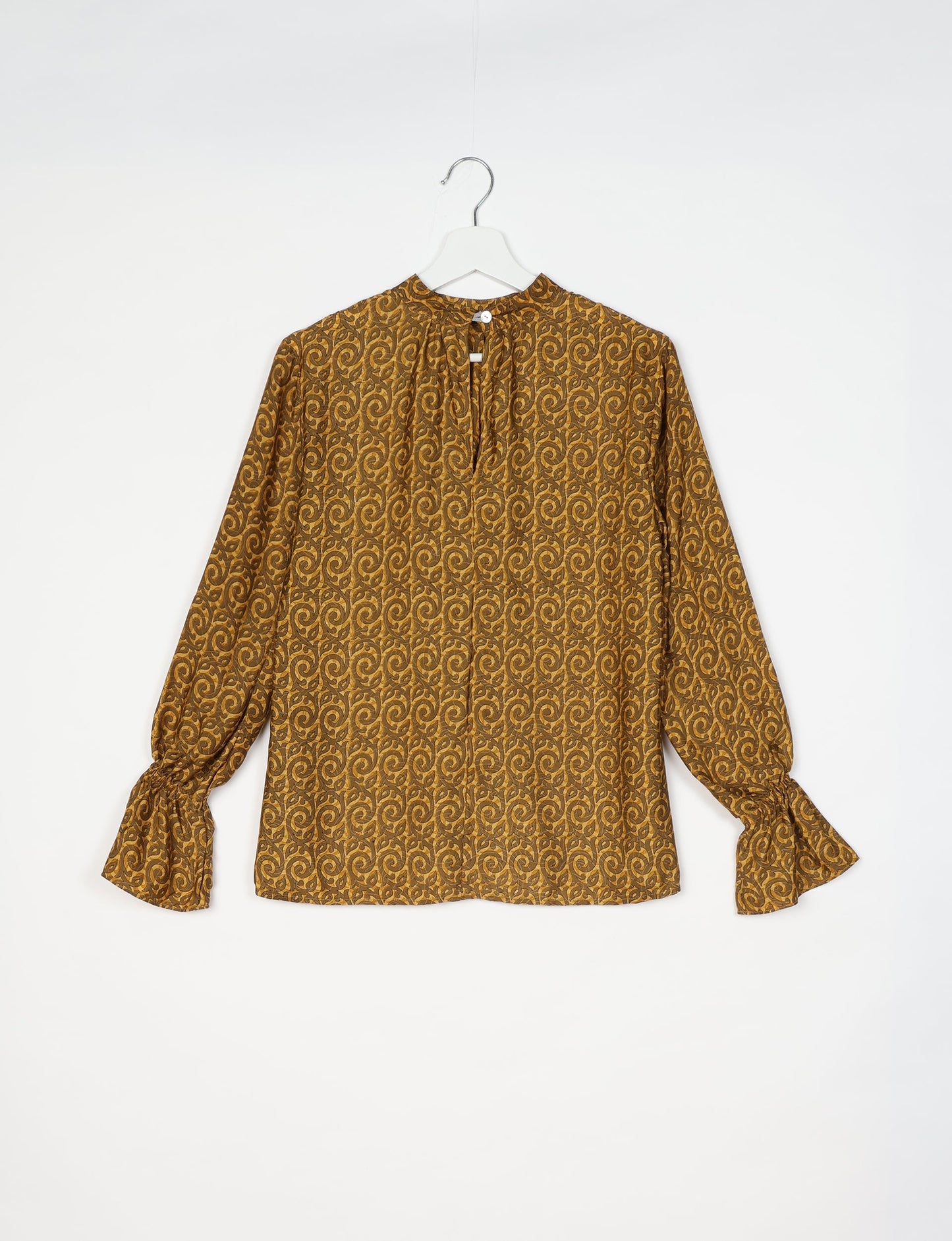 Flowing blouse with peasant sleeves and gathered neckline made from upcycled garments and repurposed clothing, showcasing eco clothing and fair trade fashion in a stylish, comfortable design.