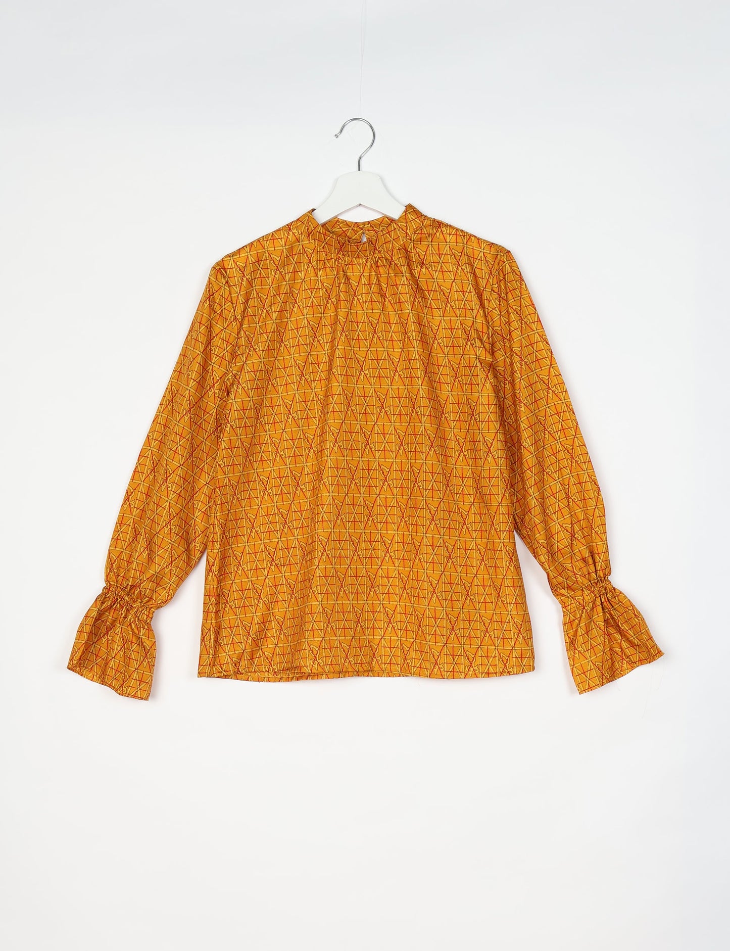 Flowing blouse with peasant sleeves and gathered neckline made from upcycled garments and repurposed clothing, showcasing eco clothing and fair trade fashion in a stylish, comfortable design.