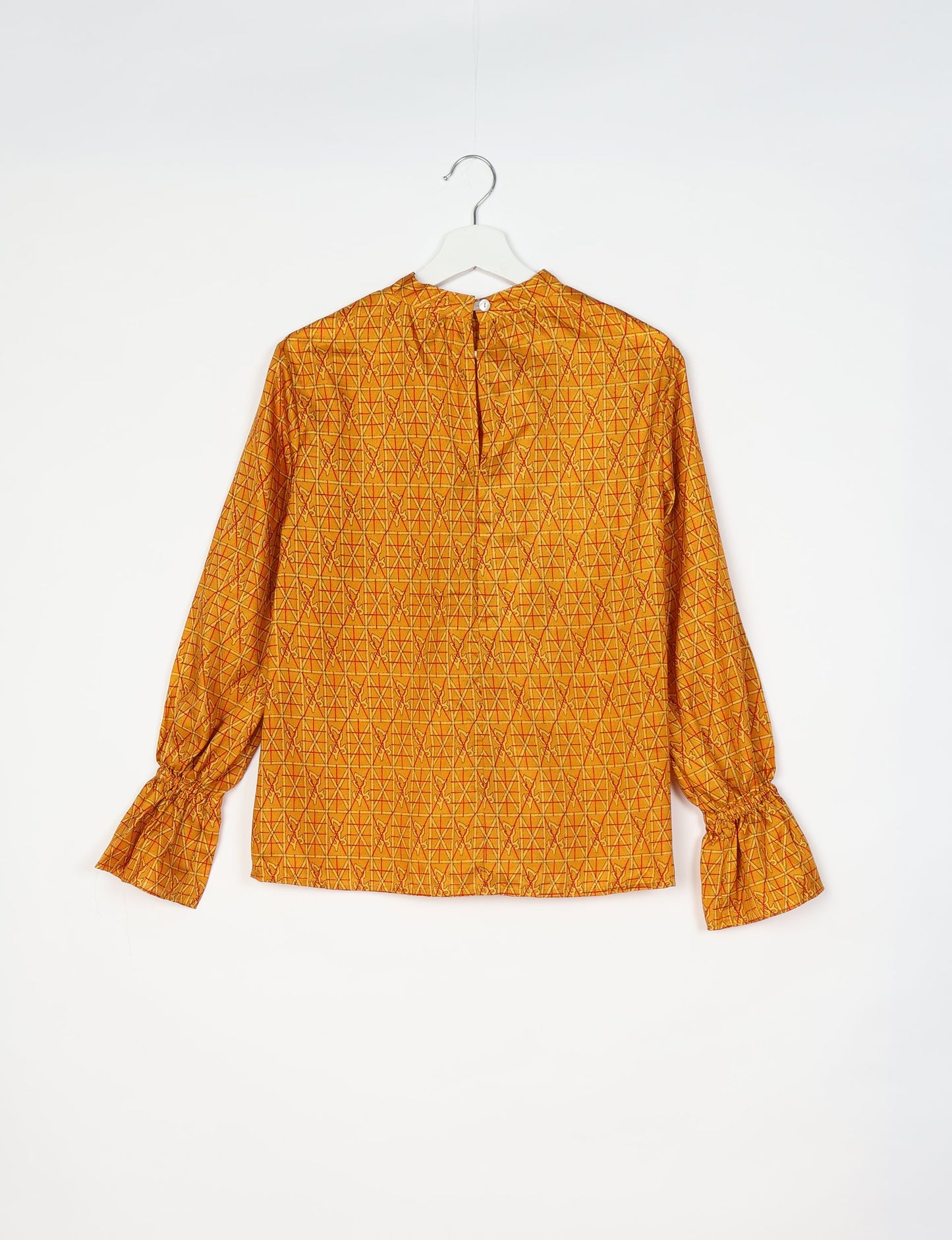 Flowing blouse with peasant sleeves and gathered neckline made from upcycled garments and repurposed clothing, showcasing eco clothing and fair trade fashion in a stylish, comfortable design.