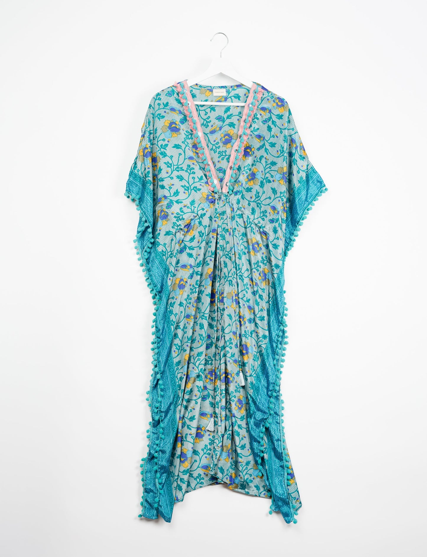 Breezy Kaftan with intricate contrasting lace and embroidery neckline, highlighting the essence of recycled sustainable fashion, slow fashion, and repurposed clothing. A perfect example of eco clothing and conscious clothing, made from recycled materials, promoting carbon neutral fashion and ethical fashion. Ideal for those seeking upcycled garments and natural clothing, as part of the sustainable apparel movement.