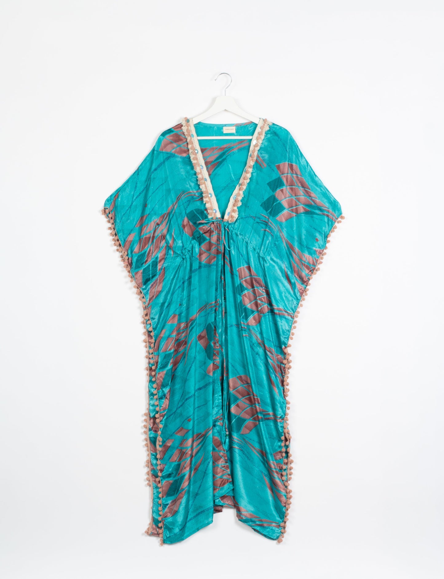 Breezy Kaftan with intricate contrasting lace and embroidery neckline, highlighting the essence of recycled sustainable fashion, slow fashion, and repurposed clothing. A perfect example of eco clothing and conscious clothing, made from recycled materials, promoting carbon neutral fashion and ethical fashion. Ideal for those seeking upcycled garments and natural clothing, as part of the sustainable apparel movement.