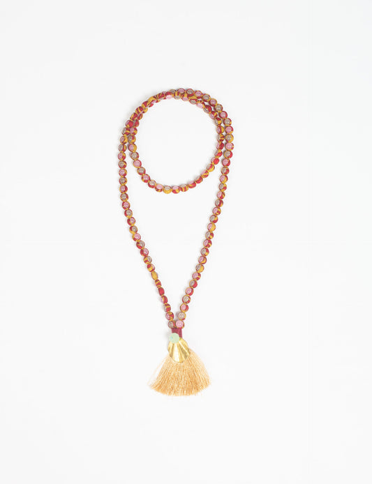 Discover elegance in our Beaded Tassel Necklace, meticulously handcrafted with glass beads, a silk tassel, and a metallic pendant. Hypoallergenic metal hooks provide a skin-friendly and stylish accessory. Length: 57 cm / 22.5 inches.