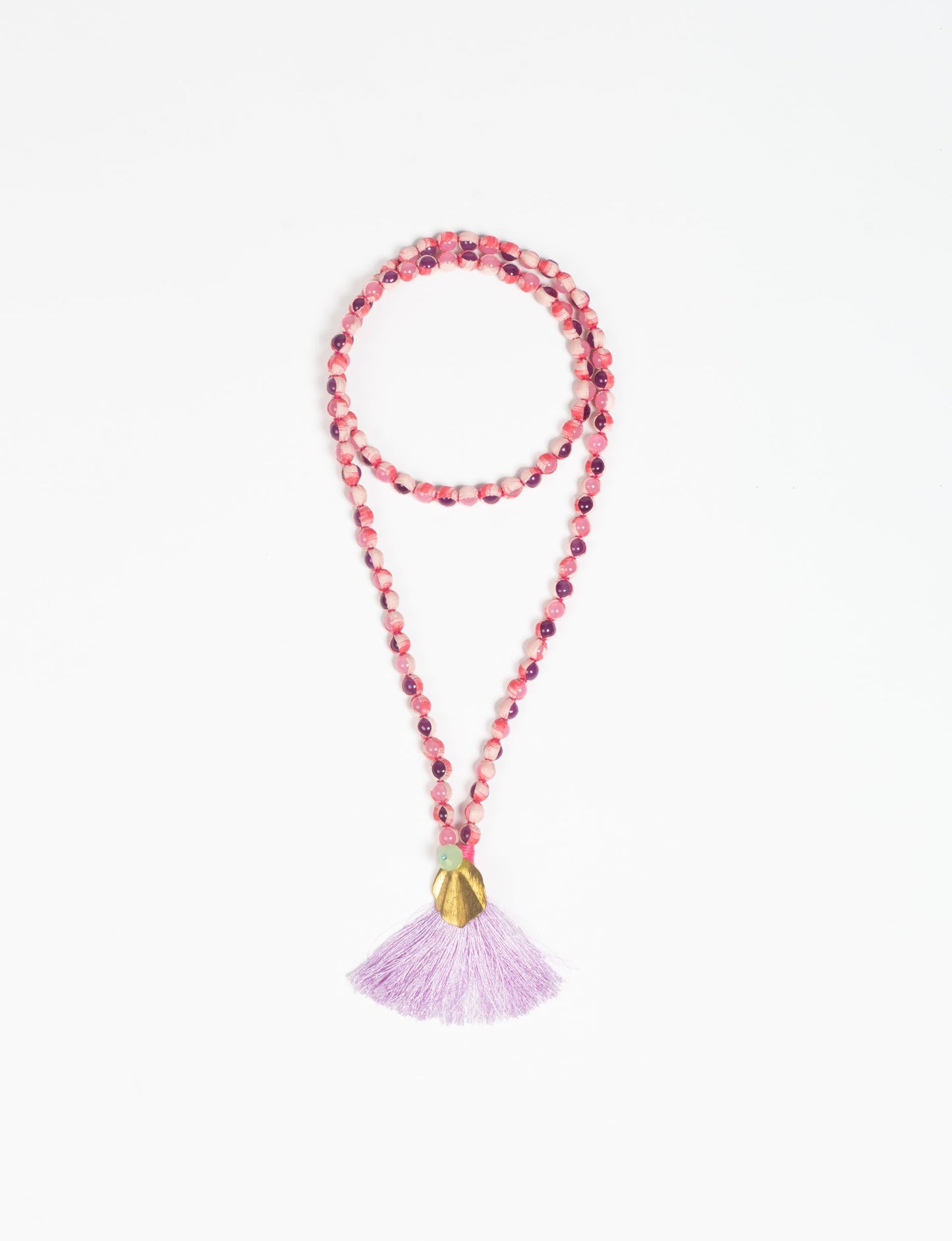 Discover elegance in our Beaded Tassel Necklace, meticulously handcrafted with glass beads, a silk tassel, and a metallic pendant. Hypoallergenic metal hooks provide a skin-friendly and stylish accessory. Length: 57 cm / 22.5 inches.