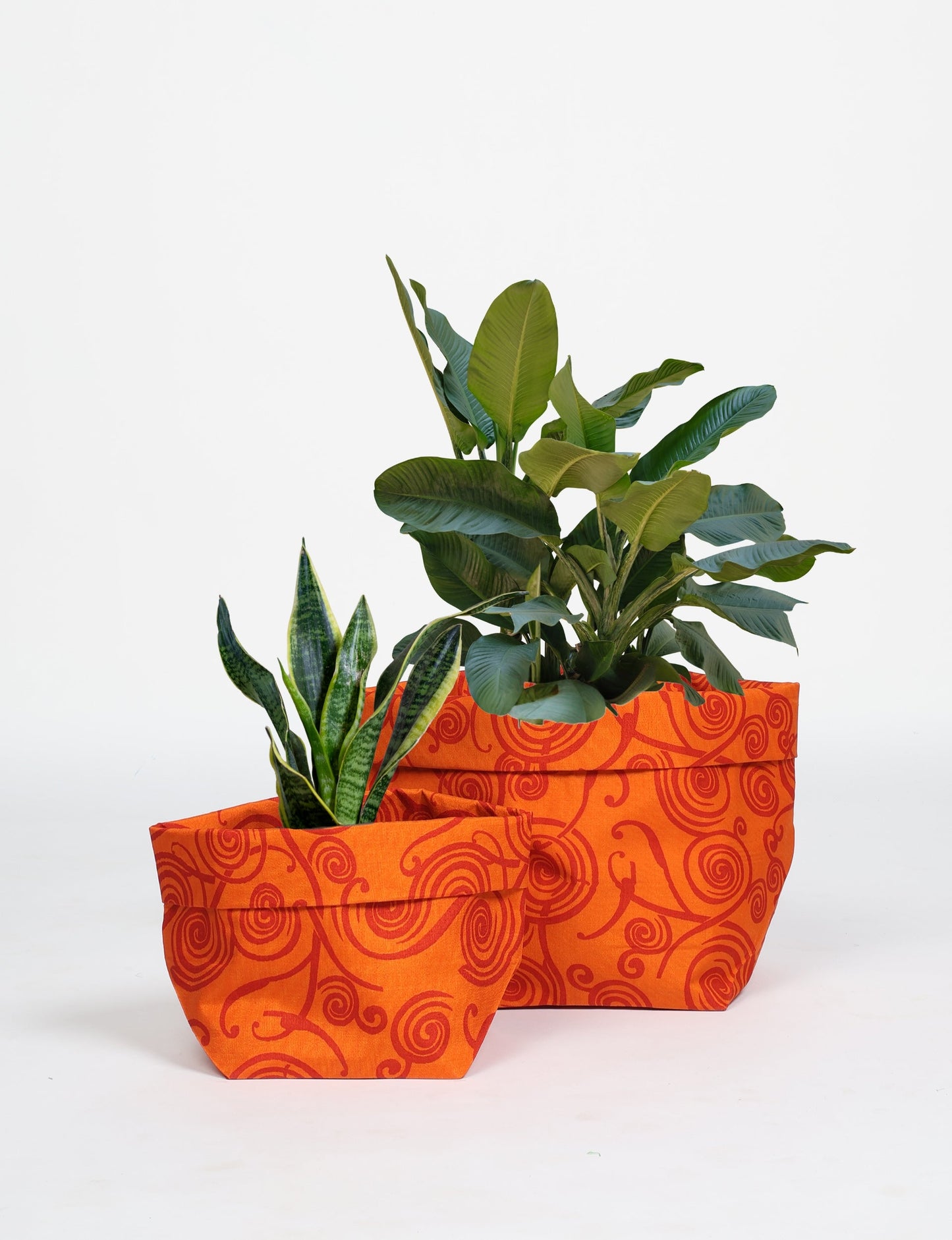 Upgrade your plant aesthetics sustainably with our PLANT POT COVER SET – two handmade covers crafted from preloved saris. Ethical and green, these covers bring eco-friendly charm to your plants and your space.