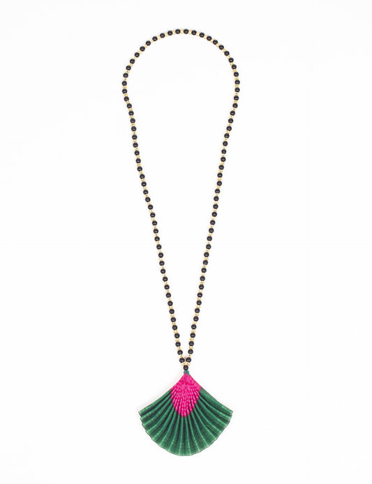 Dive into sustainable fashion with our PLEATED NECKLACE, a creation by talented female artisans in Mumbai. The pleated fan pendant, made from upcycled saris, hangs on a colorful necklace crafted from glass beads, embellished with sparkling glass crystals. An ethical, green fashion statement for conscious styling.