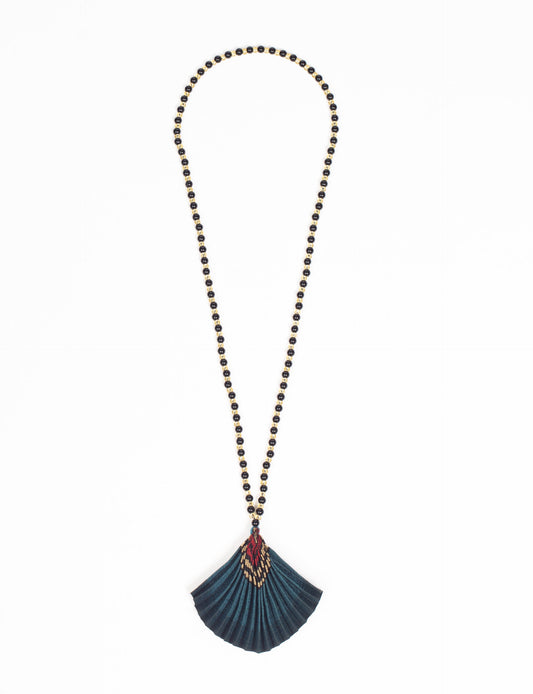 Dive into sustainable fashion with our PLEATED NECKLACE, a creation by talented female artisans in Mumbai. The pleated fan pendant, made from upcycled saris, hangs on a colorful necklace crafted from glass beads, embellished with sparkling glass crystals. An ethical, green fashion statement for conscious styling.