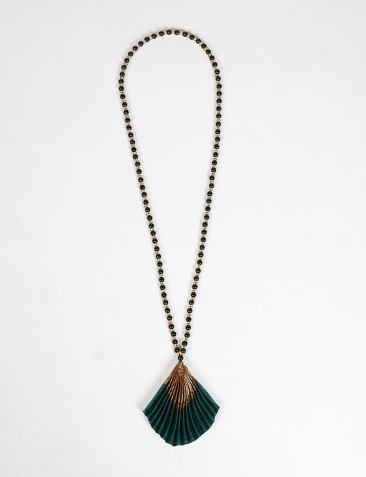 Dive into sustainable fashion with our PLEATED NECKLACE, a creation by talented female artisans in Mumbai. The pleated fan pendant, made from upcycled saris, hangs on a colorful necklace crafted from glass beads, embellished with sparkling glass crystals. An ethical, green fashion statement for conscious styling.