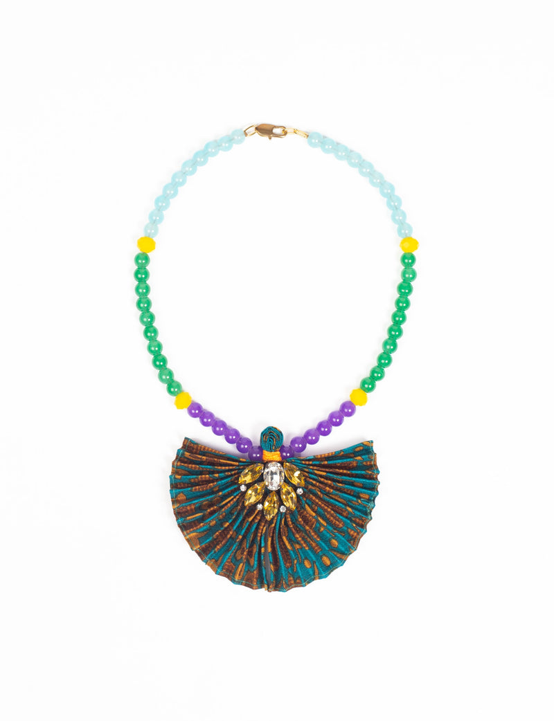 Beaded necklace with green, purple, and yellow beads and a pleated fabric pendant with gemstone embellishments