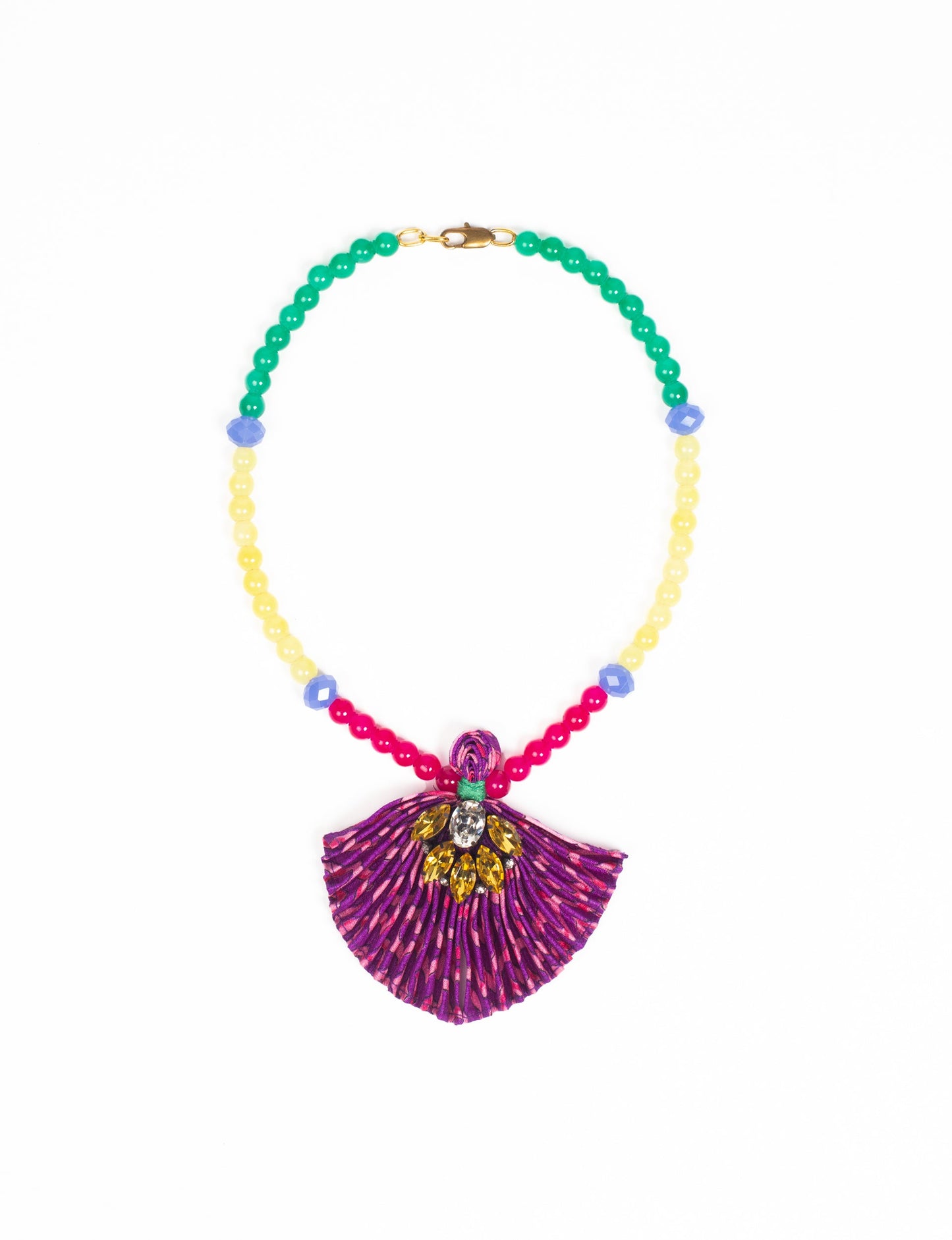 Dive into sustainable fashion with our PLEATED NECKLACE, a creation by talented female artisans in Mumbai. The pleated fan pendant, made from upcycled saris, hangs on a colorful necklace crafted from glass beads, embellished with sparkling glass crystals. An ethical, green fashion statement for conscious styling.