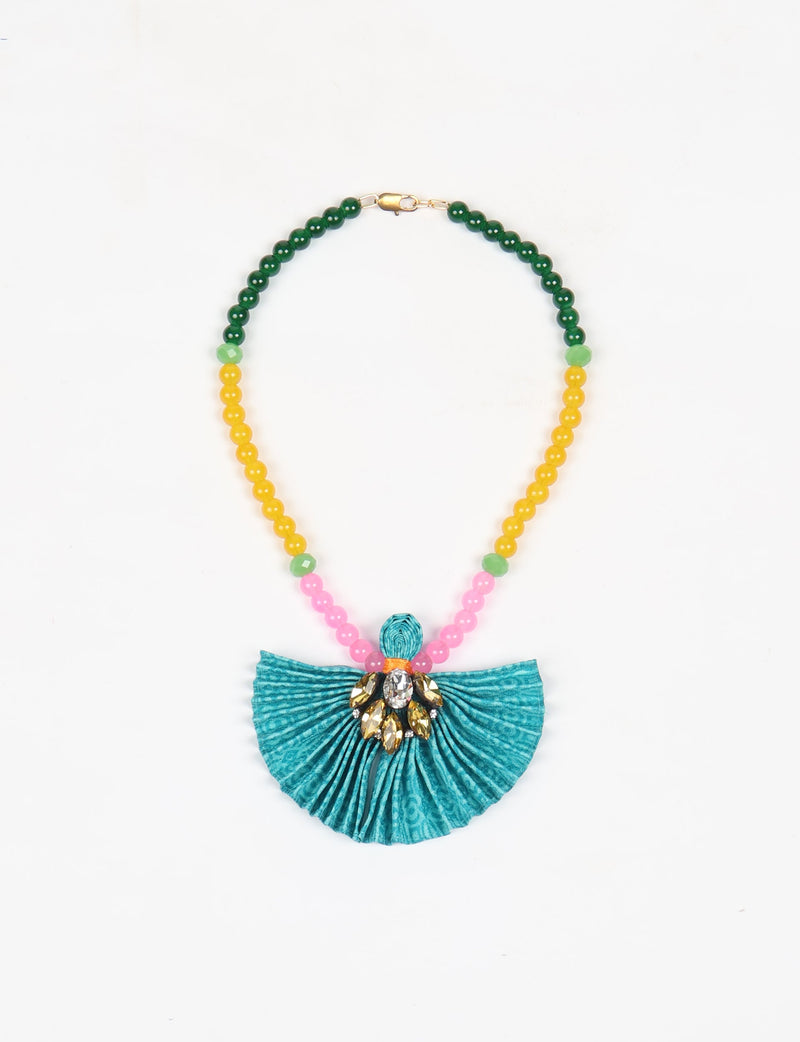 Beaded necklace with green, yellow, and pink round beads, featuring a pleated blue fabric pendant with gold and clear gems