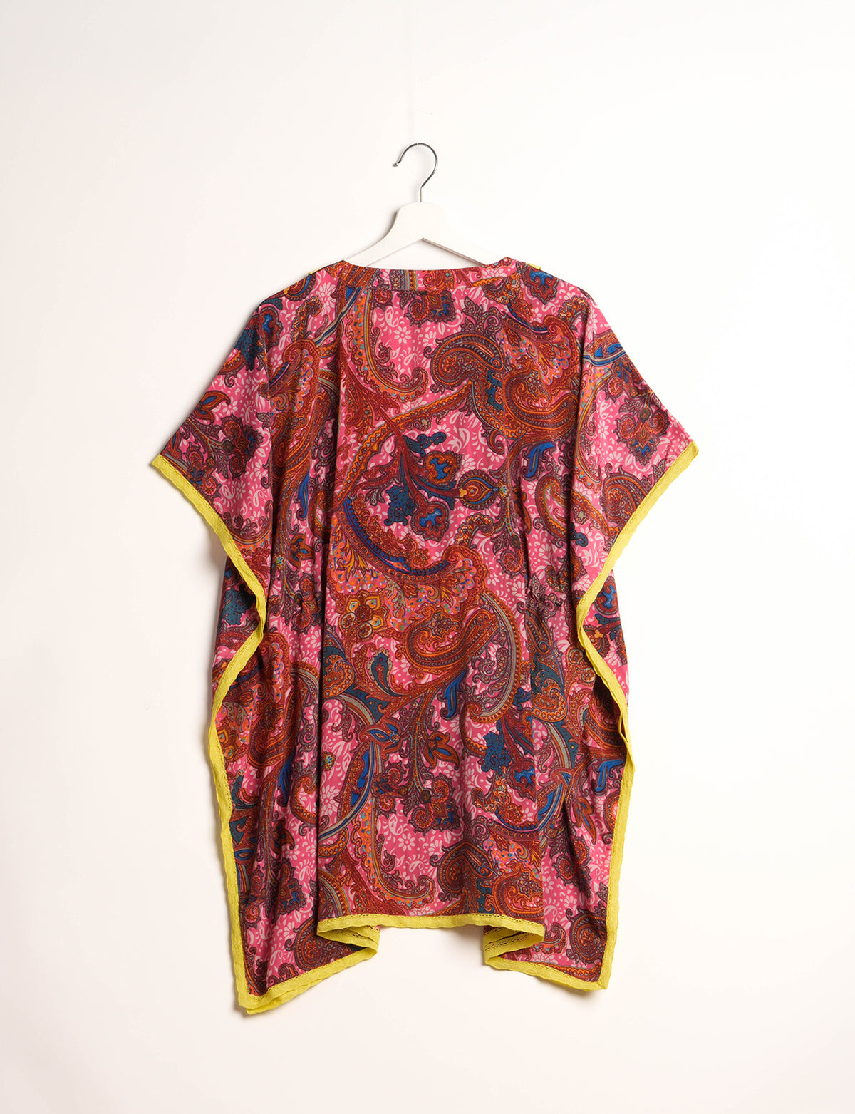 Elevate your style with our short kaftan, a perfect blend of ethical and green fashion. The light and loose-flowing fabric, drawstring waist, beaded tassel ends, and delicate lace edging make it a versatile choice for urban summers, beachwear, or poolside elegance. Enjoy sustainable and fashionable living.