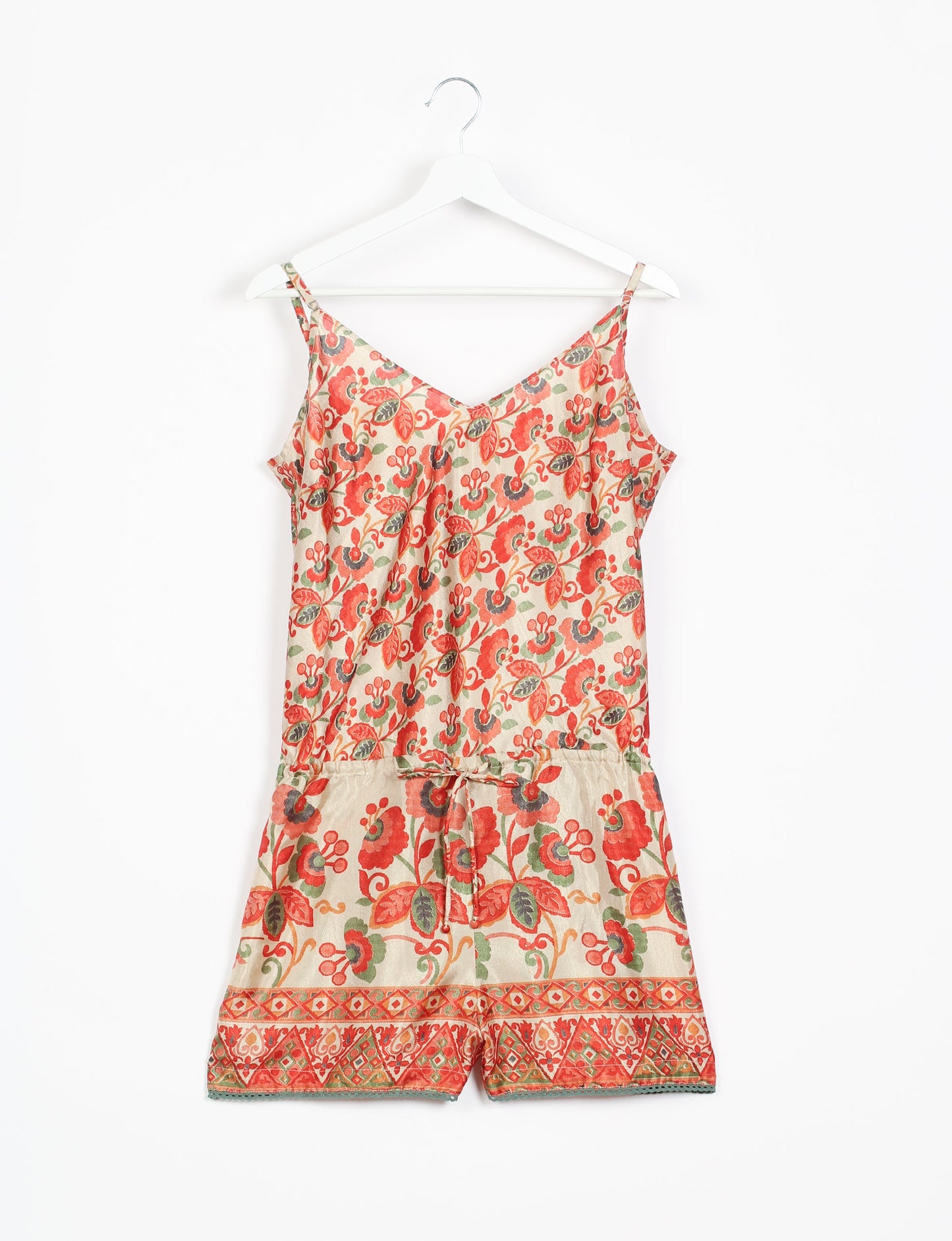 Vibrant playsuit with lace accents, crafted from upcycled saris. Embrace ethical fashion with this unique piece designed for conscious consumers.