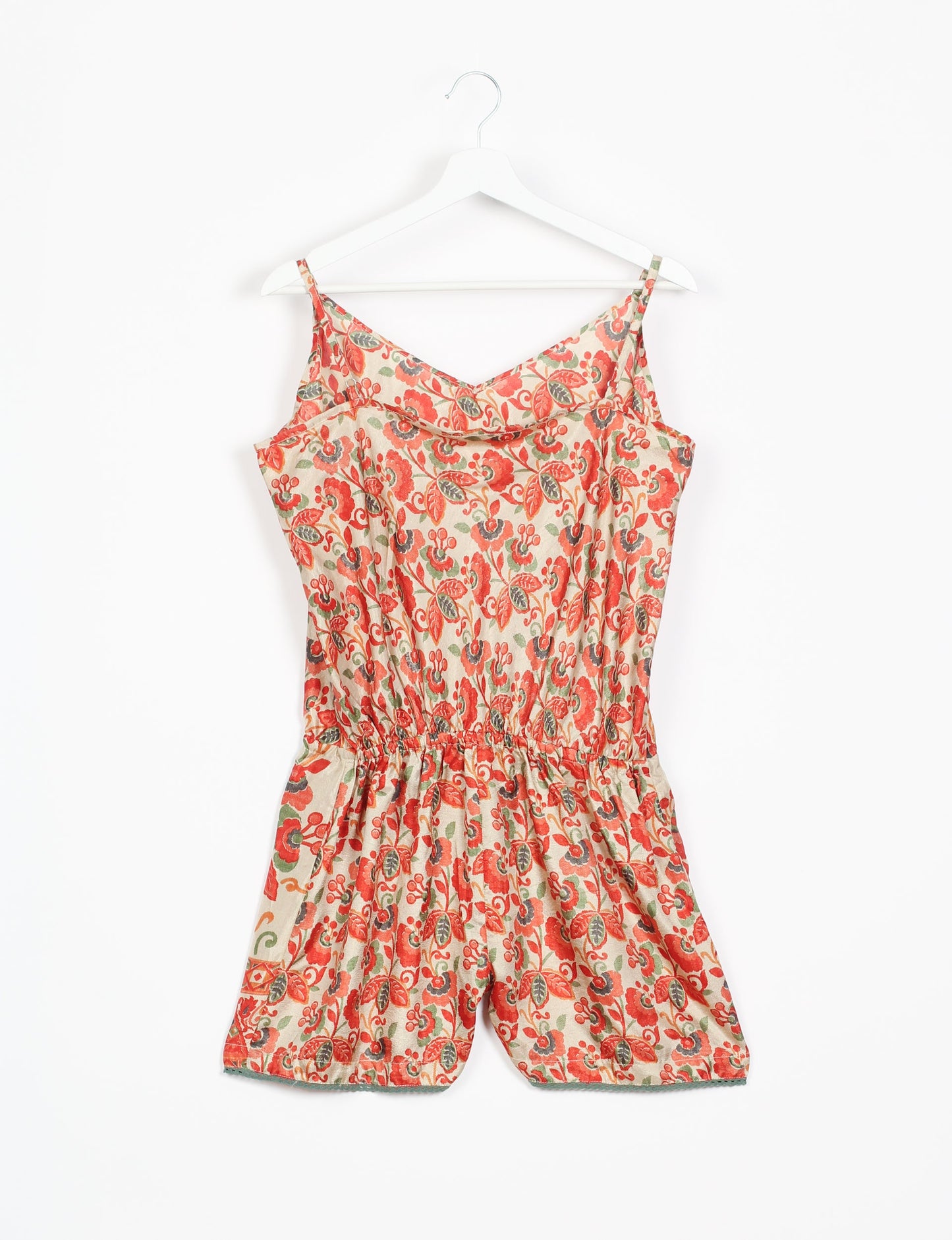 Vibrant playsuit with lace accents, crafted from upcycled saris. Embrace ethical fashion with this unique piece designed for conscious consumers.