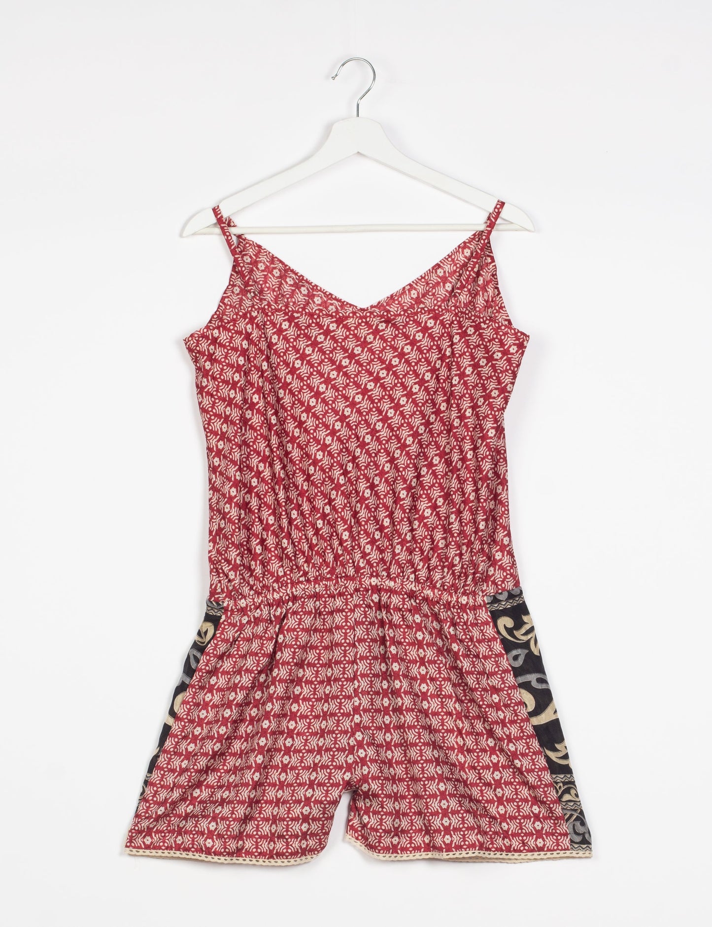 Vibrant playsuit with lace accents, crafted from upcycled saris. Embrace ethical fashion with this unique piece designed for conscious consumers.