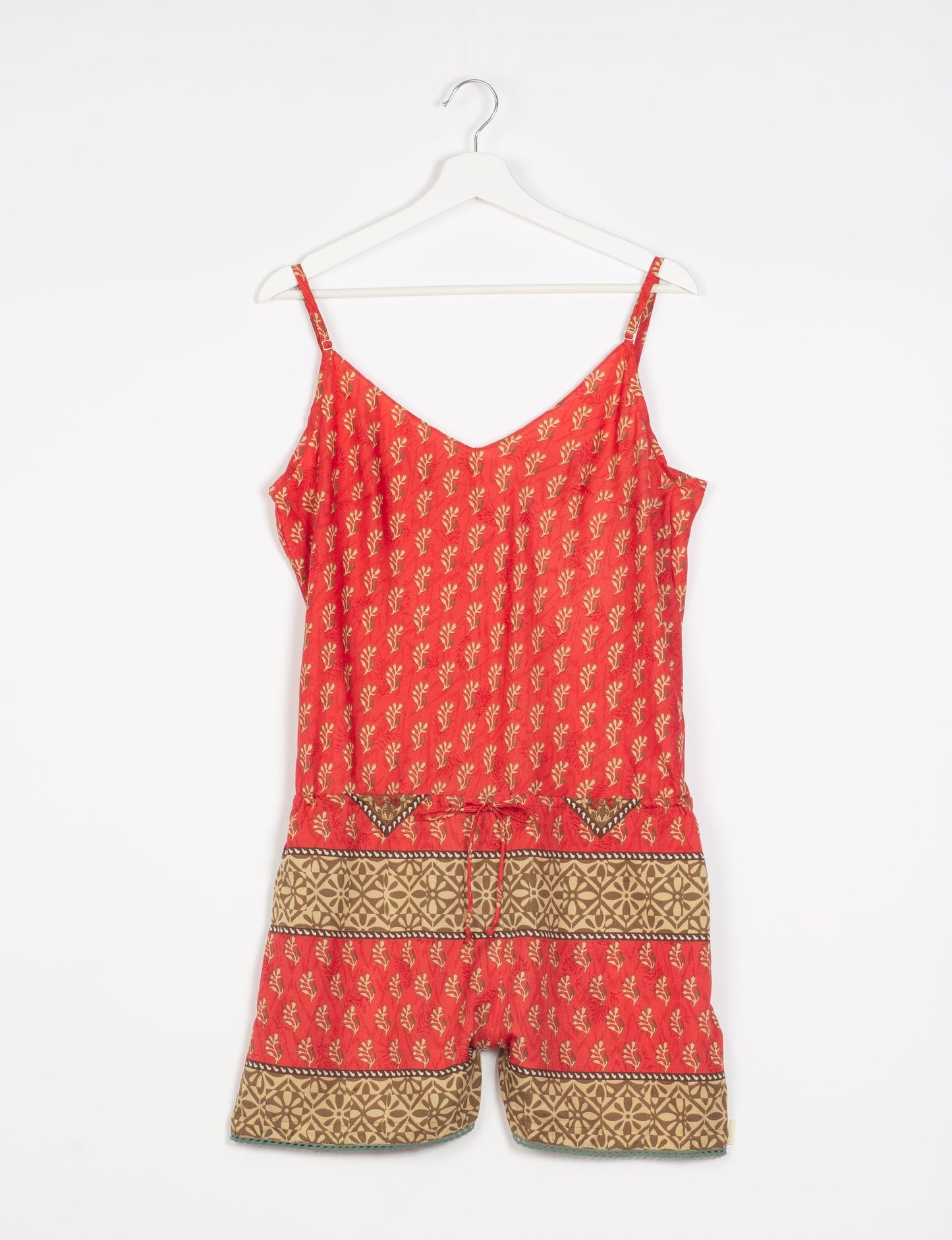 Vibrant playsuit with lace accents, crafted from upcycled saris. Embrace ethical fashion with this unique piece designed for conscious consumers.