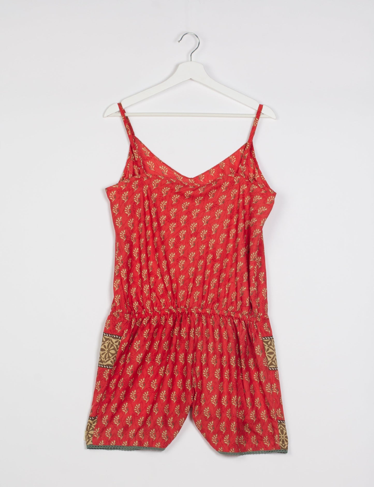 Vibrant playsuit with lace accents, crafted from upcycled saris. Embrace ethical fashion with this unique piece designed for conscious consumers.