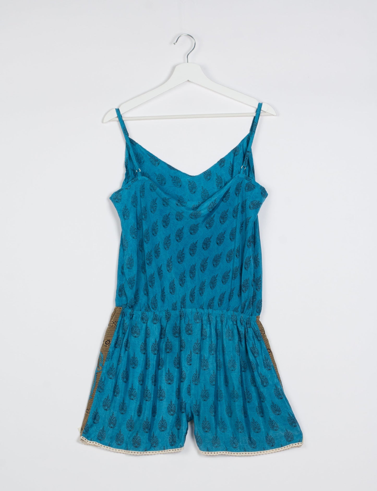 Vibrant playsuit with lace accents, crafted from upcycled saris. Embrace ethical fashion with this unique piece designed for conscious consumers.