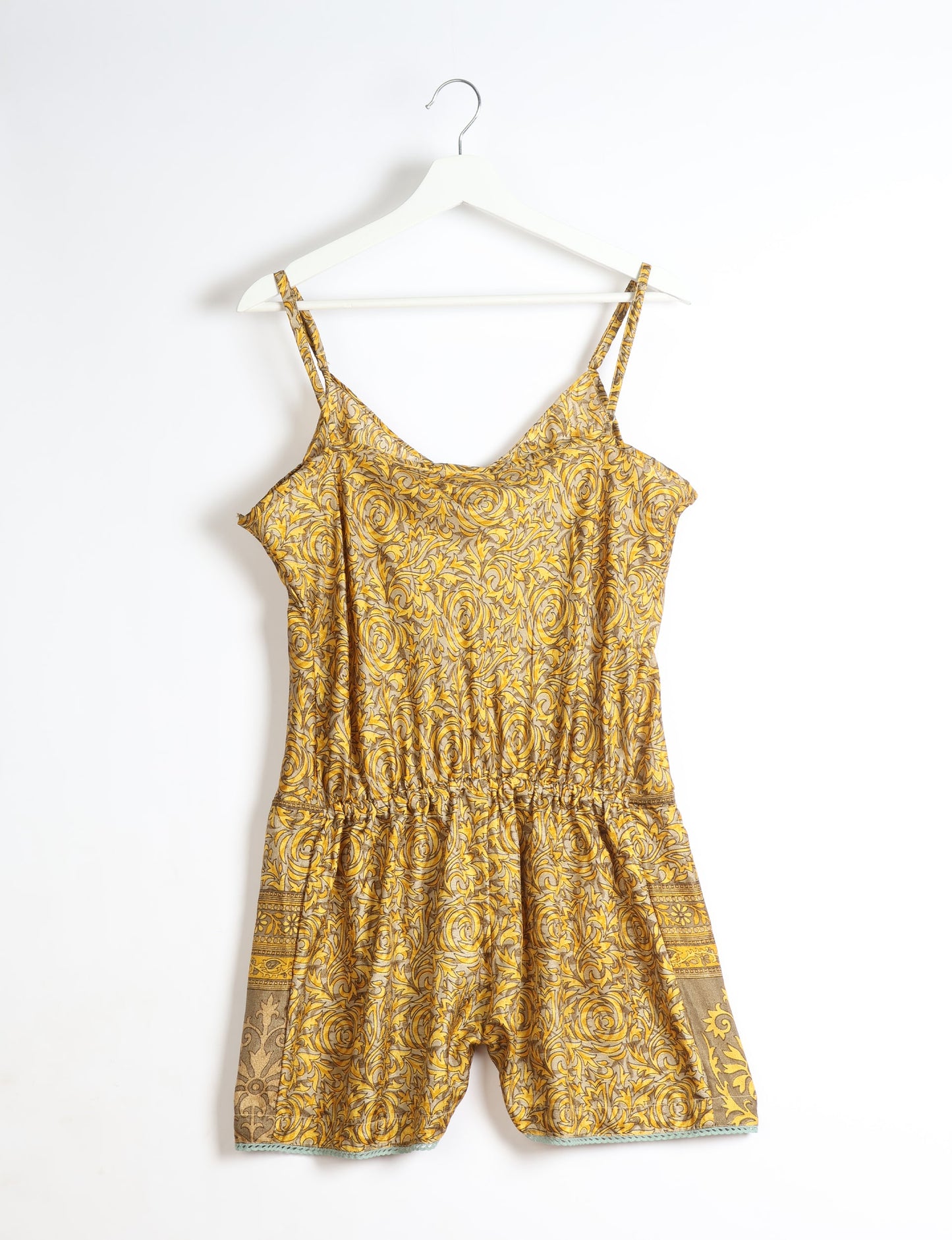 Vibrant playsuit with lace accents, crafted from upcycled saris. Embrace ethical fashion with this unique piece designed for conscious consumers.