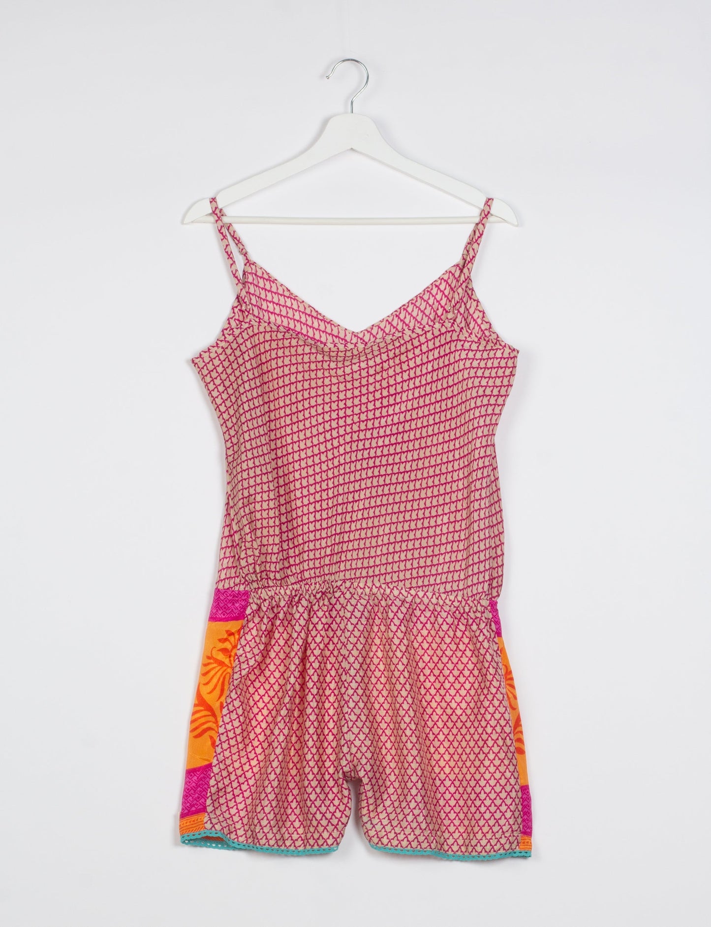 Vibrant playsuit with lace accents, crafted from upcycled saris. Embrace ethical fashion with this unique piece designed for conscious consumers.