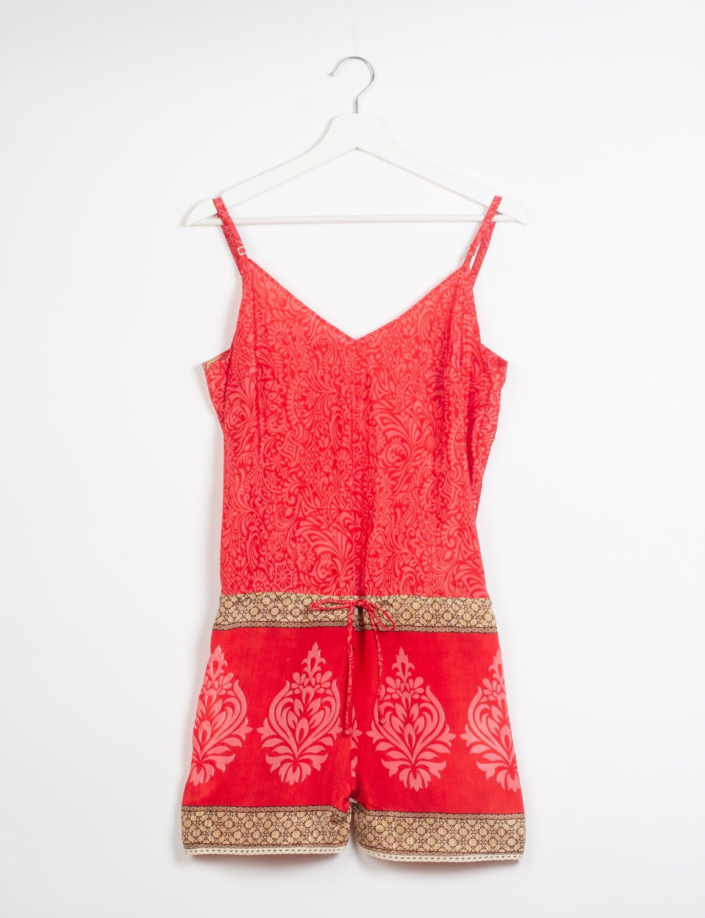 Vibrant playsuit with lace accents, crafted from upcycled saris. Embrace ethical fashion with this unique piece designed for conscious consumers.