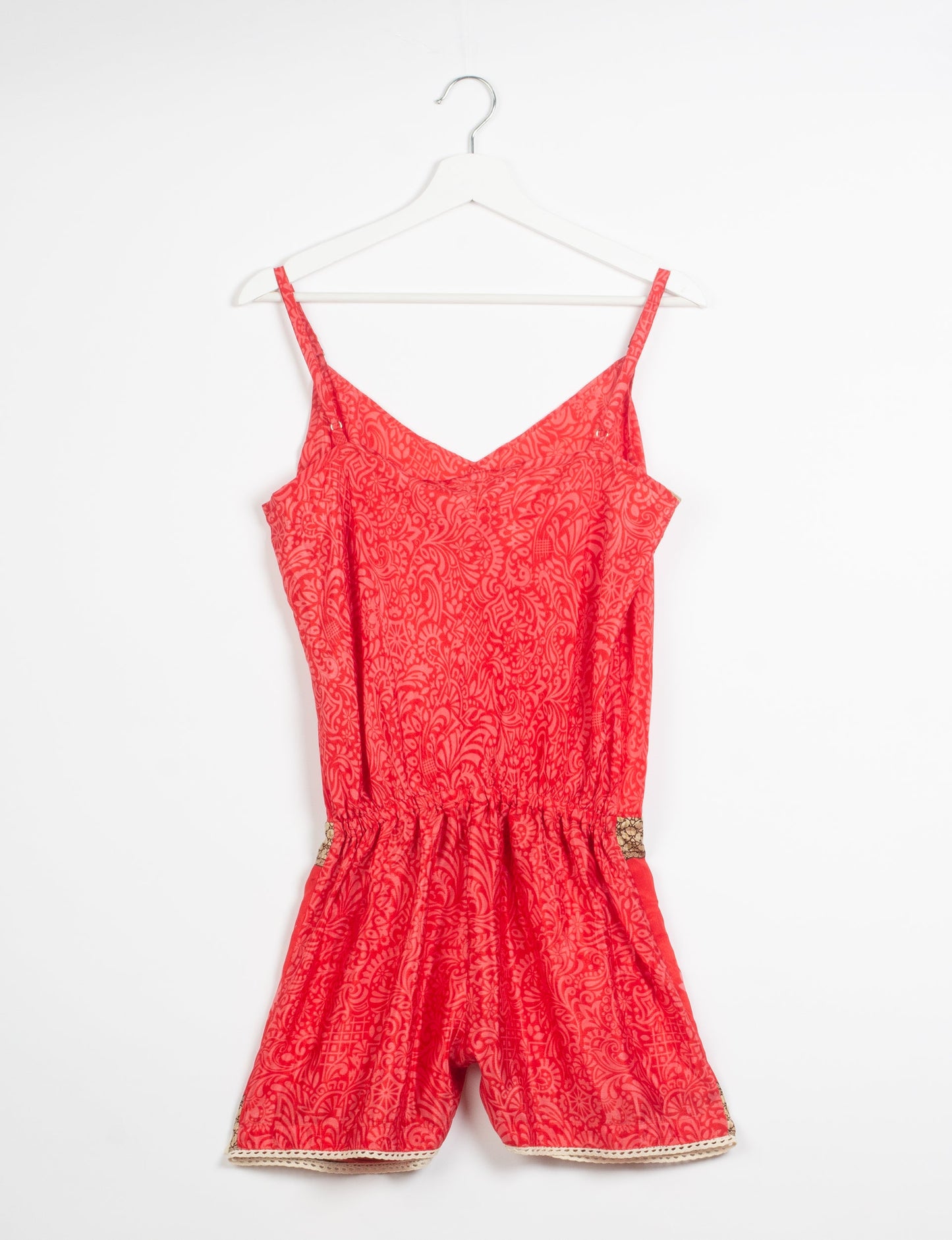 Vibrant playsuit with lace accents, crafted from upcycled saris. Embrace ethical fashion with this unique piece designed for conscious consumers.