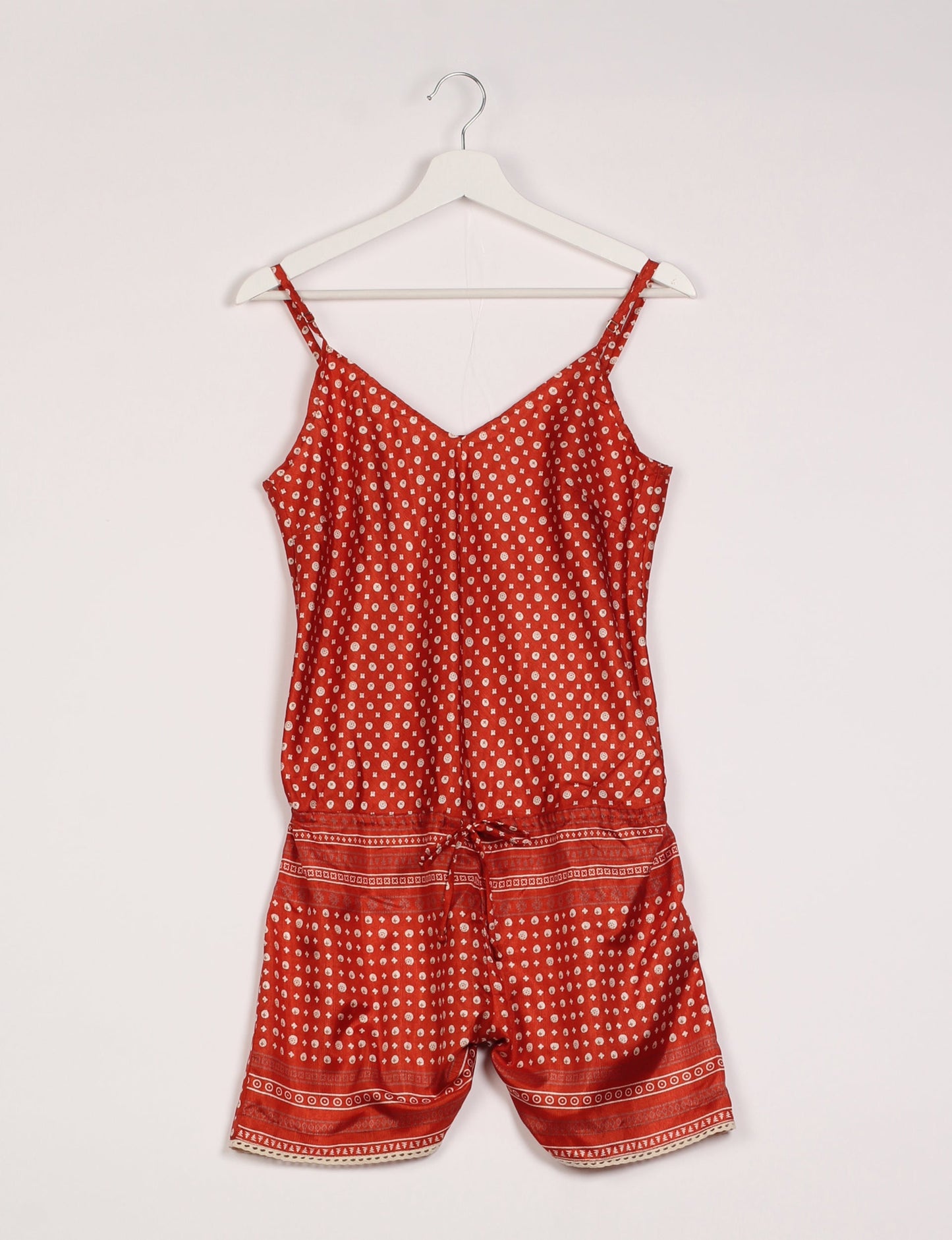 Vibrant playsuit with lace accents, crafted from upcycled saris. Embrace ethical fashion with this unique piece designed for conscious consumers.