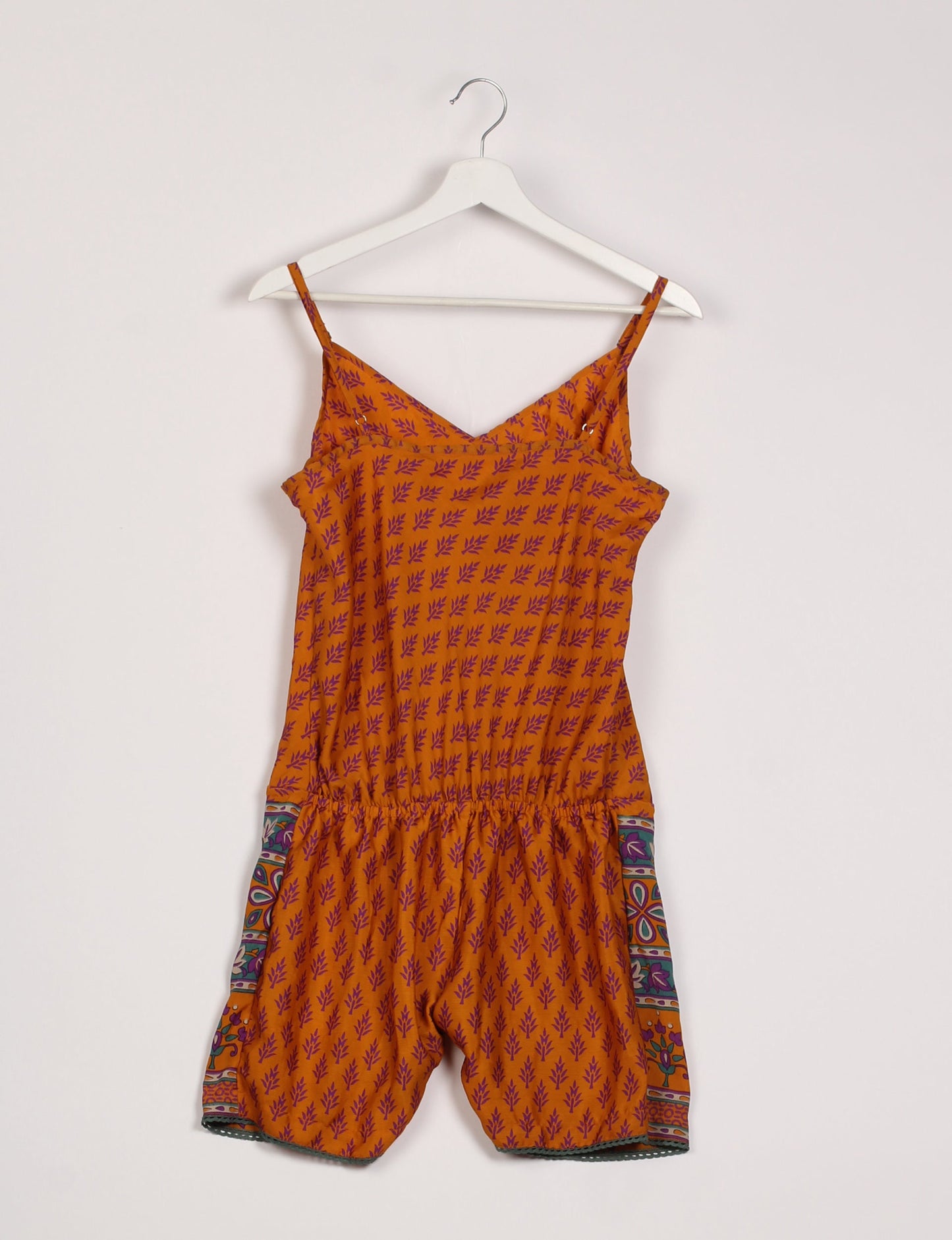 Vibrant playsuit with lace accents, crafted from upcycled saris. Embrace ethical fashion with this unique piece designed for conscious consumers.