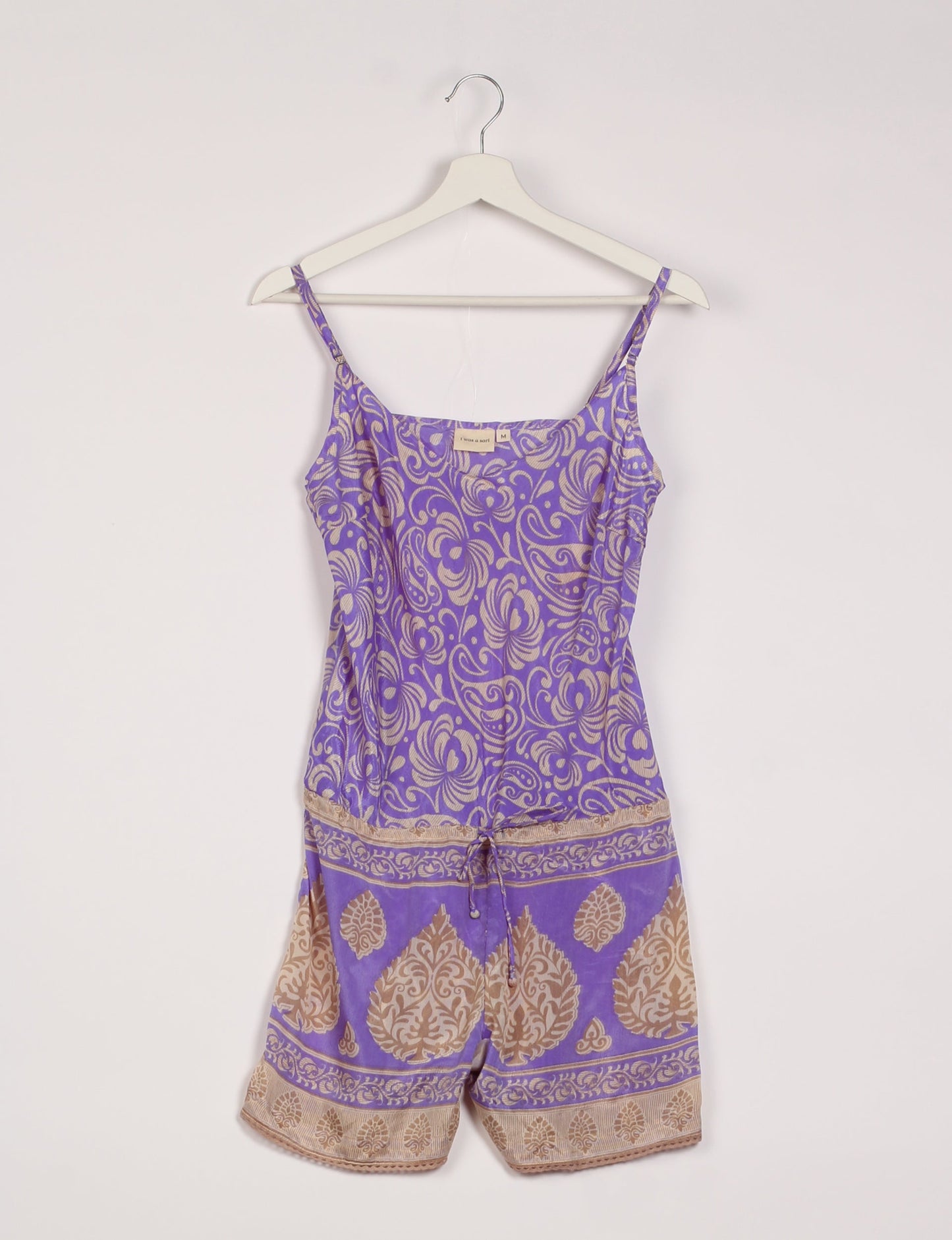 Vibrant playsuit with lace accents, crafted from upcycled saris. Embrace ethical fashion with this unique piece designed for conscious consumers.