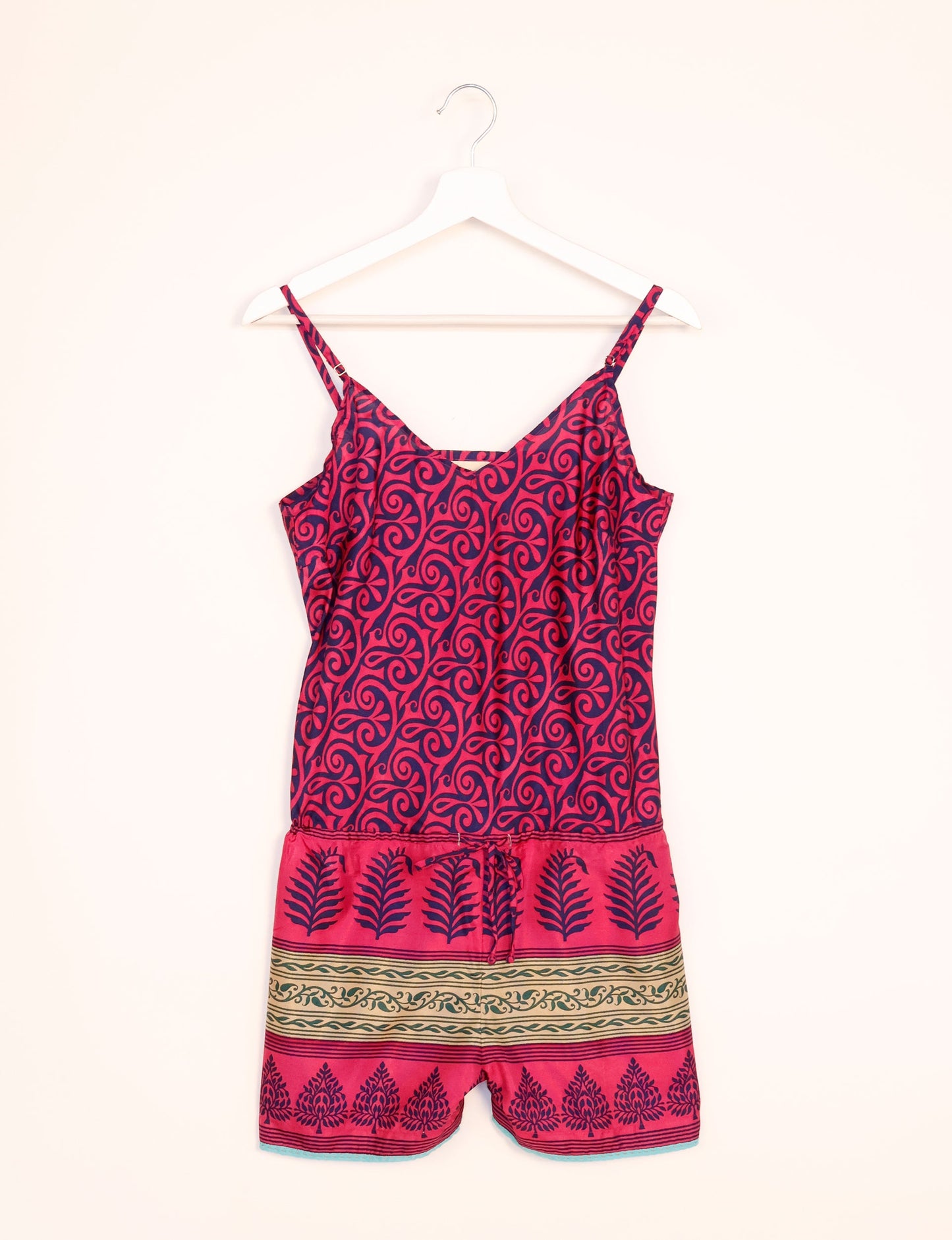 Vibrant playsuit with lace accents, crafted from upcycled saris. Embrace ethical fashion with this unique piece designed for conscious consumers.