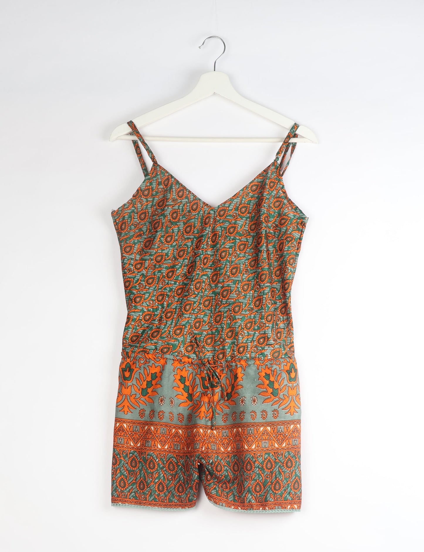 Vibrant playsuit with lace accents, crafted from upcycled saris. Embrace ethical fashion with this unique piece designed for conscious consumers.