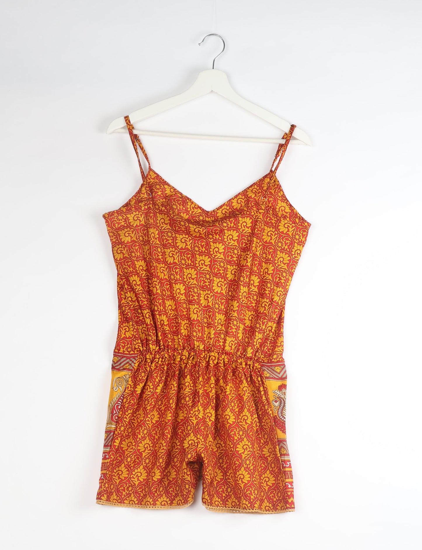 Vibrant playsuit with lace accents, crafted from upcycled saris. Embrace ethical fashion with this unique piece designed for conscious consumers.