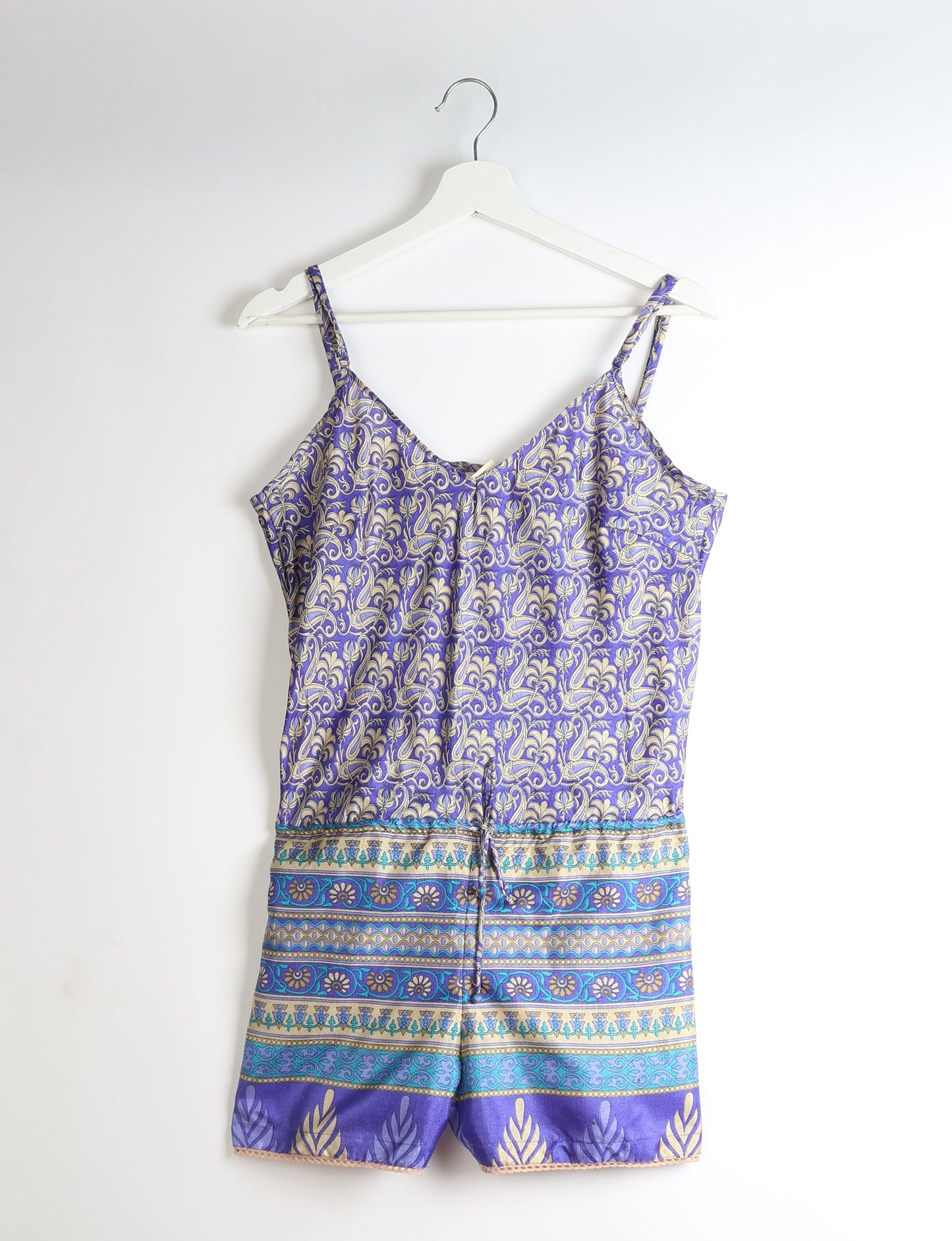 Vibrant playsuit with lace accents, crafted from upcycled saris. Embrace ethical fashion with this unique piece designed for conscious consumers.