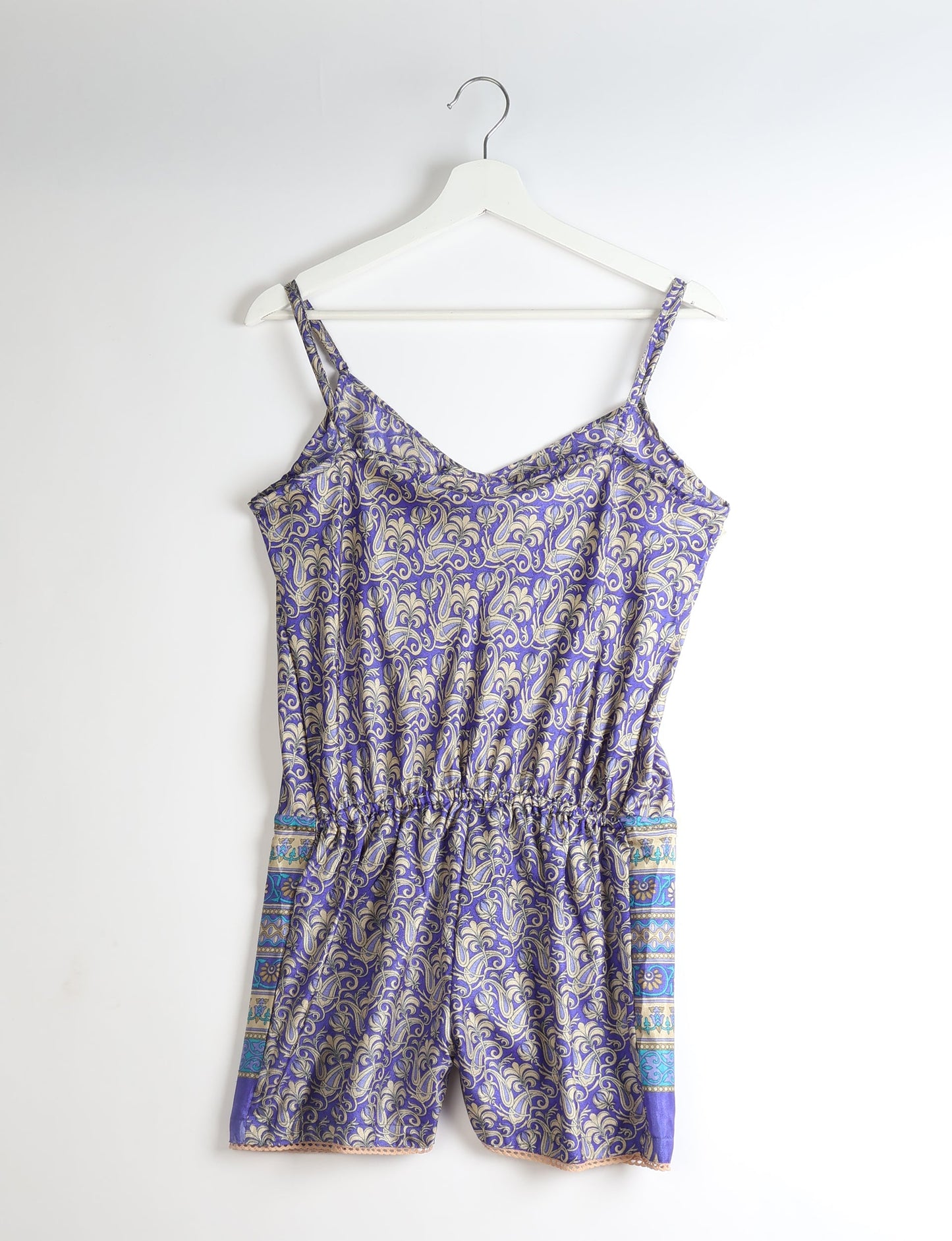 Vibrant playsuit with lace accents, crafted from upcycled saris. Embrace ethical fashion with this unique piece designed for conscious consumers.