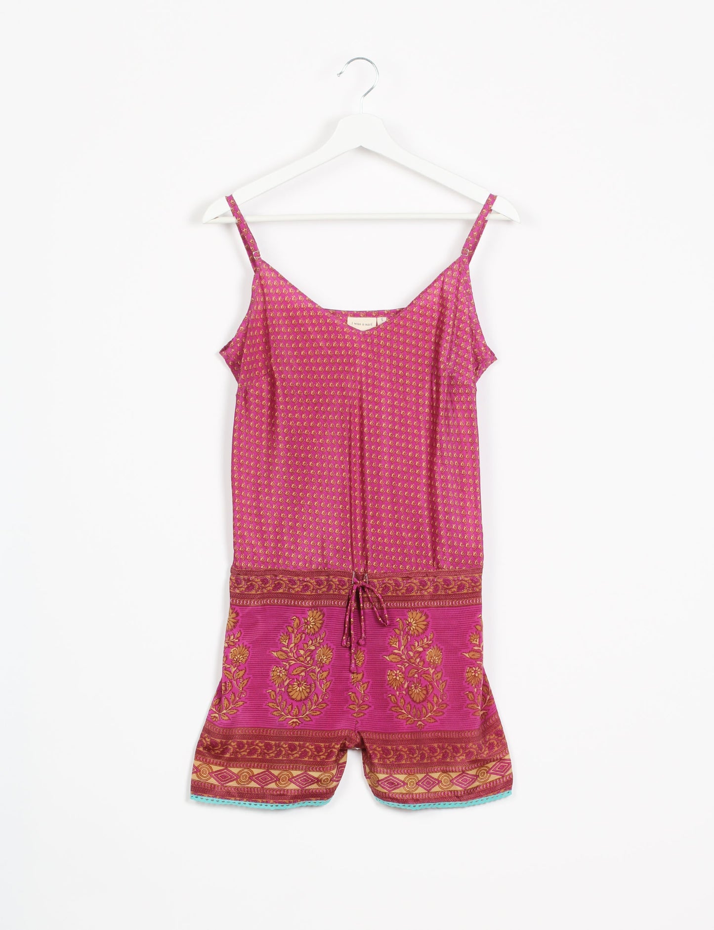 Vibrant playsuit with lace accents, crafted from upcycled saris. Embrace ethical fashion with this unique piece designed for conscious consumers.