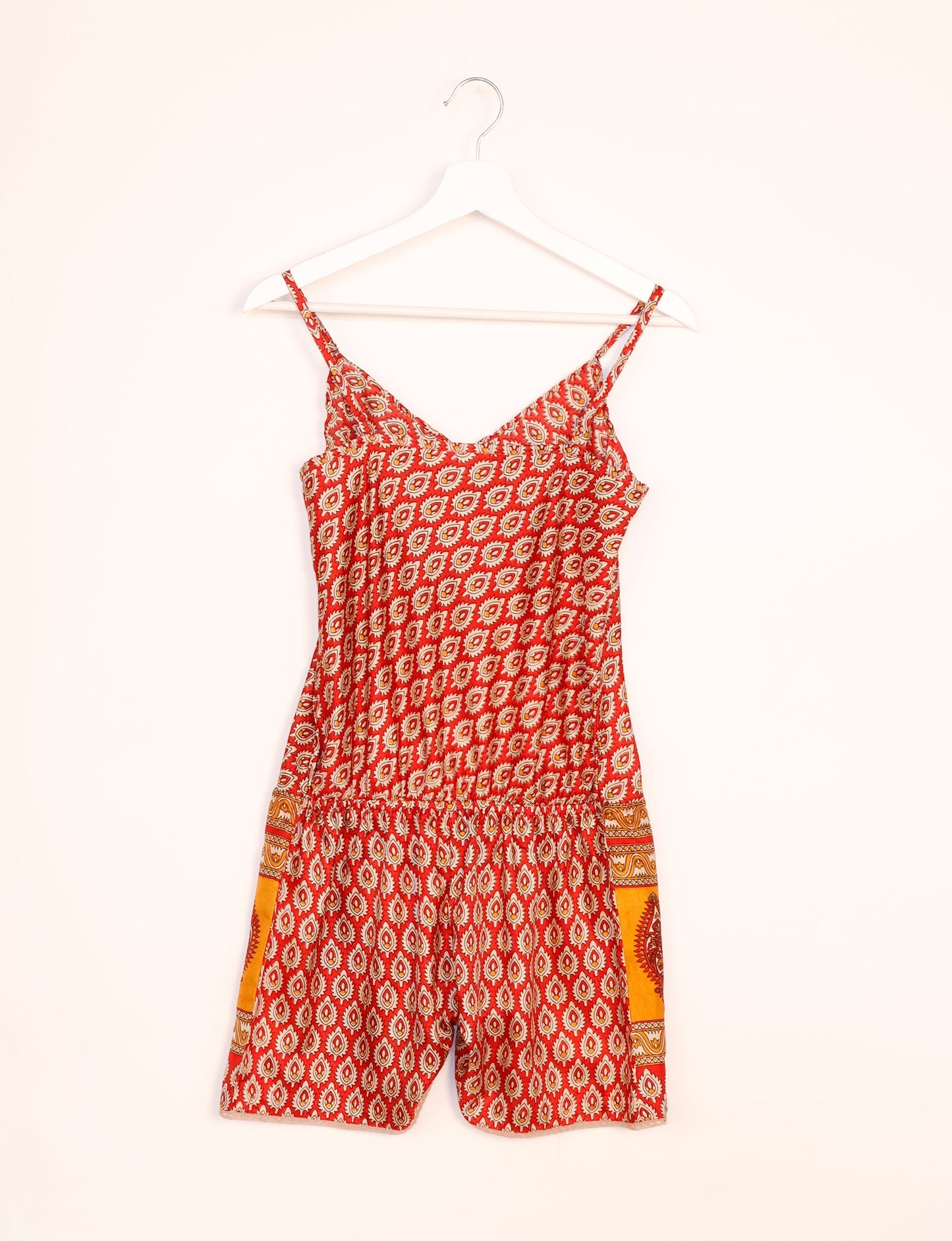 Vibrant playsuit with lace accents, crafted from upcycled saris. Embrace ethical fashion with this unique piece designed for conscious consumers.